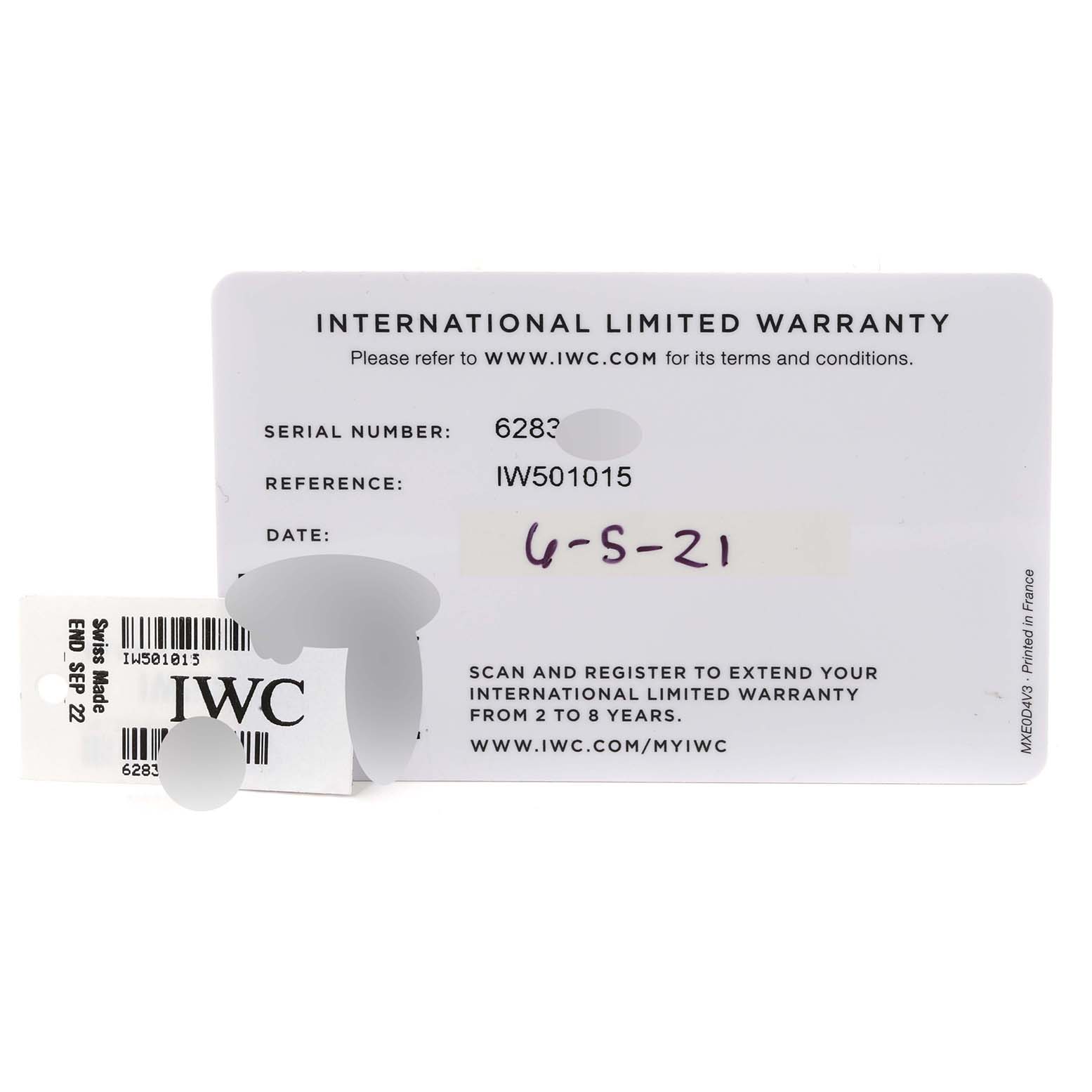 The image shows an international limited warranty card and a price tag for the IWC Pilot IW501015 Men's Stainless Steel Green Dial IW501015 Men's Stainless Steel Green Dial model watch.