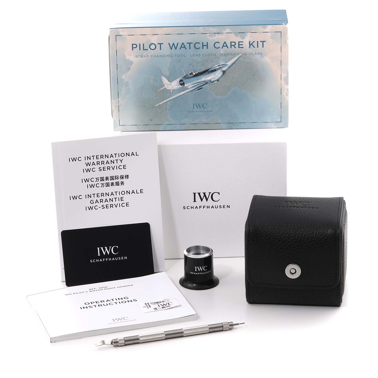 The image shows the IWC Pilot IW501015 Men's Stainless Steel Green Dial IW501015 Men's Stainless Steel Green Dial Watch care kit, including tools, documents, and a carrying case.