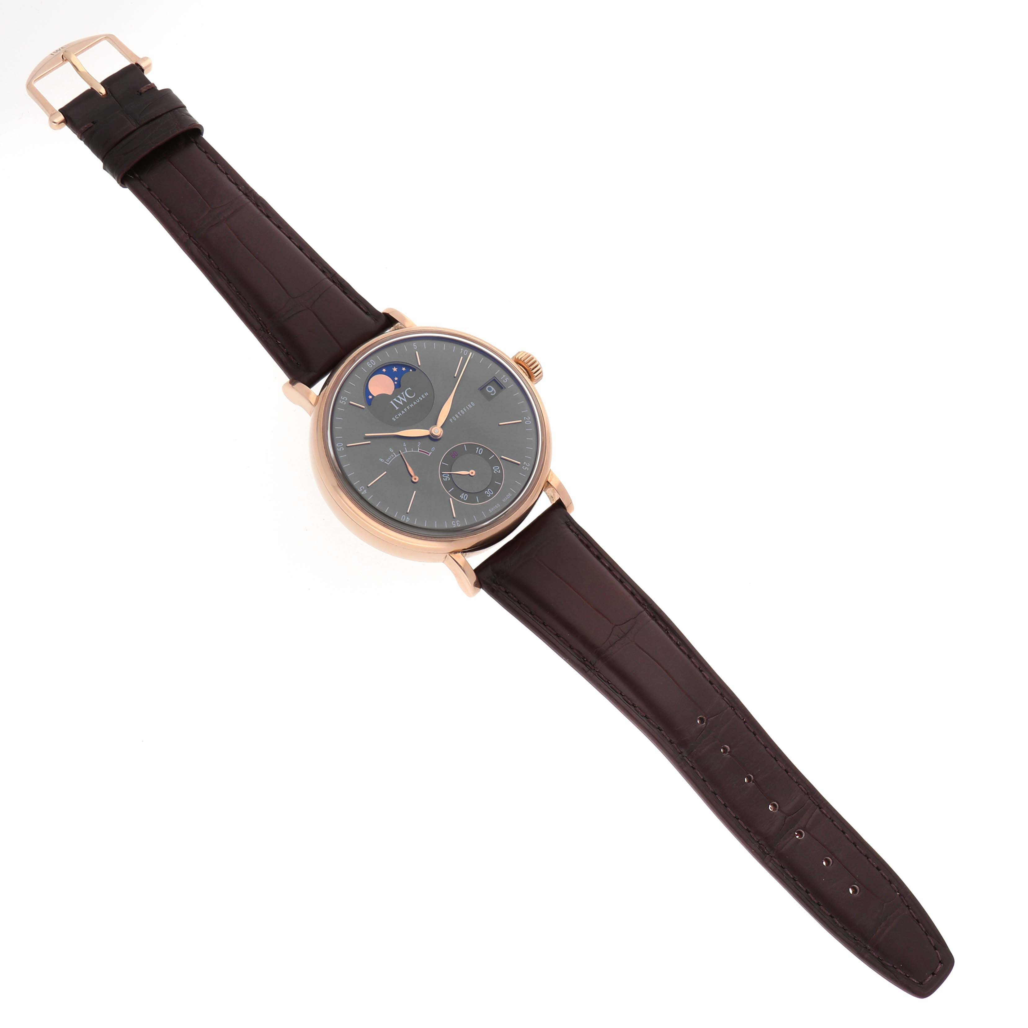 The IWC Portofino IW516403 Men's Rose Gold Grey Dial watch is shown from an angled top-down view, highlighting its face, strap, and moon phase dial.