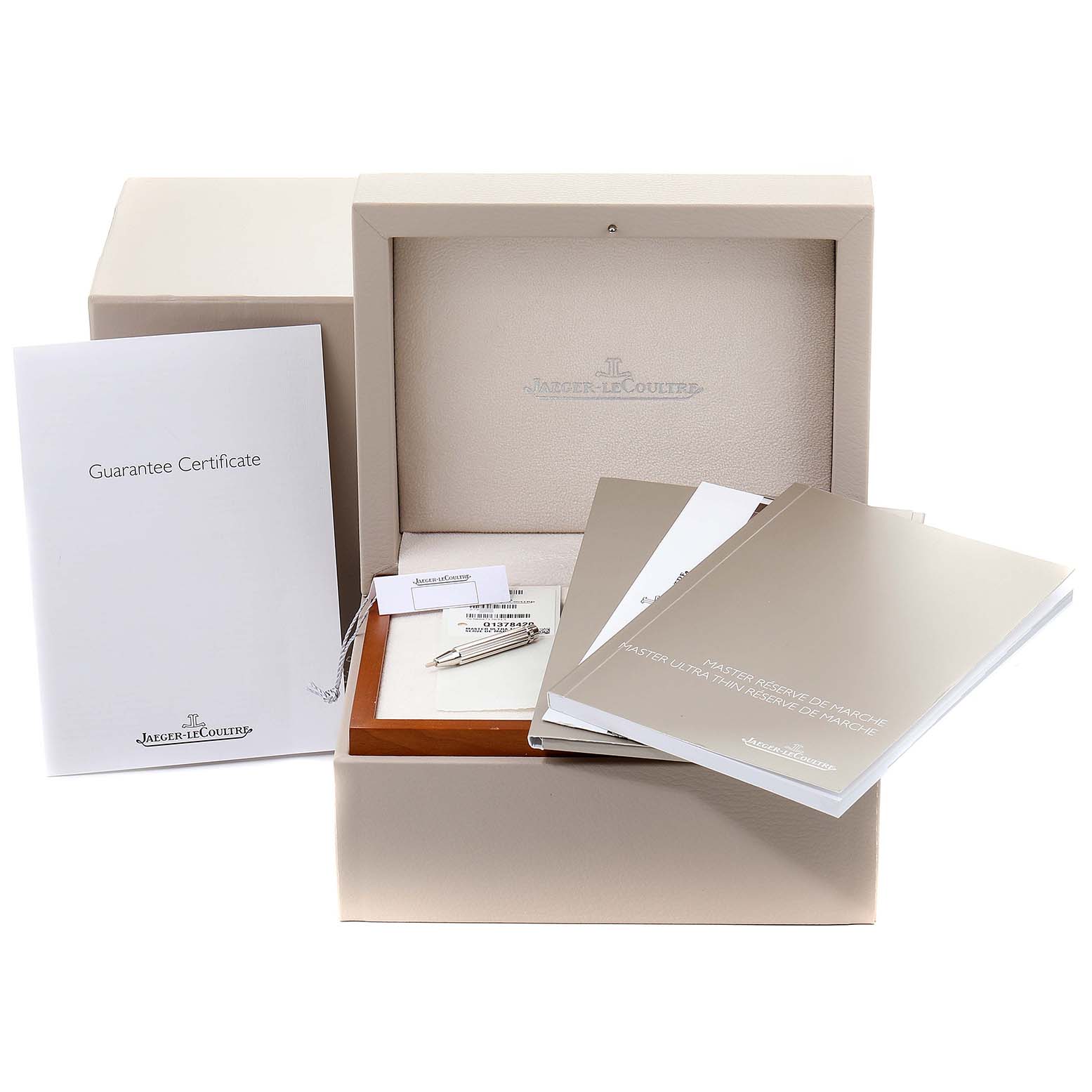 This image shows the packaging, guarantee certificate, manual, and accessories for the Jaeger-LeCoultre Master watch model.