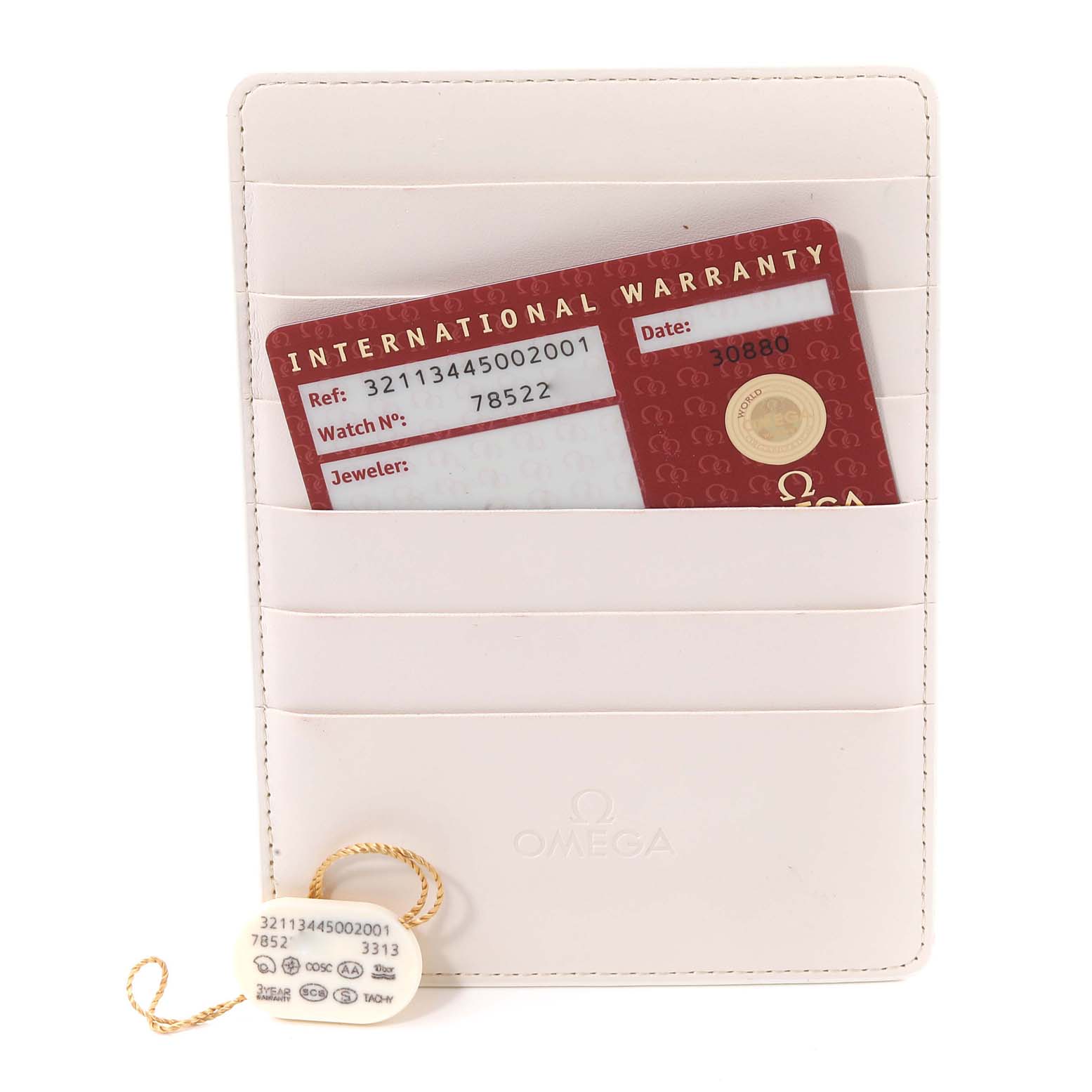 The image shows an Omega Speedmaster 321.13.44.50.02.001 Men's Stainless Steel Silver Dial 321.13.44.50.02.001 Men's Stainless Steel Silver Dial warranty card and tag, placed in a beige cardholder.