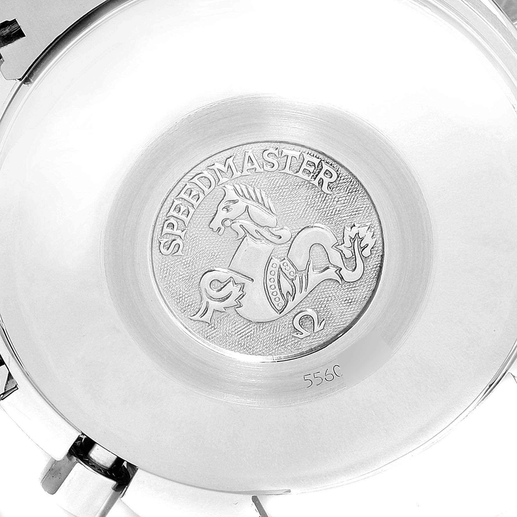 This image shows the back case of an Omega Speedmaster 3513.53.00 Men's Stainless Steel Black Dial 3513.53.00 Men's Stainless Steel Black Dial watch, featuring an engraved emblem.