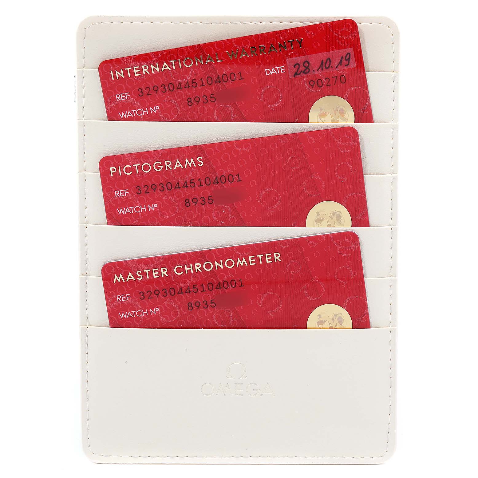 The image shows a white Omega cardholder containing three certification cards for the Omega Speedmaster 40257 Men
s Stainless Steel White Dial 40257 Men
s Stainless Steel White Dial watch.