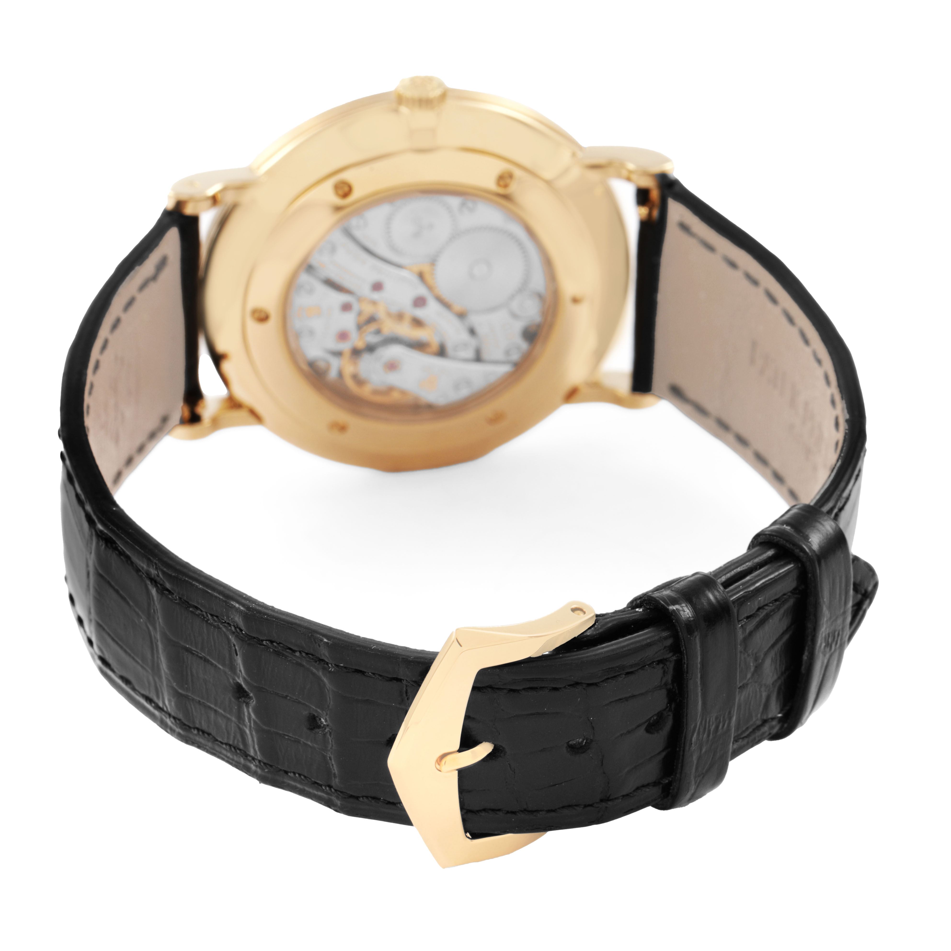 The image shows the back view of a Patek Philippe Calatrava 5119J-001 Men's Yellow Gold White Dial, highlighting the movement and black leather strap.