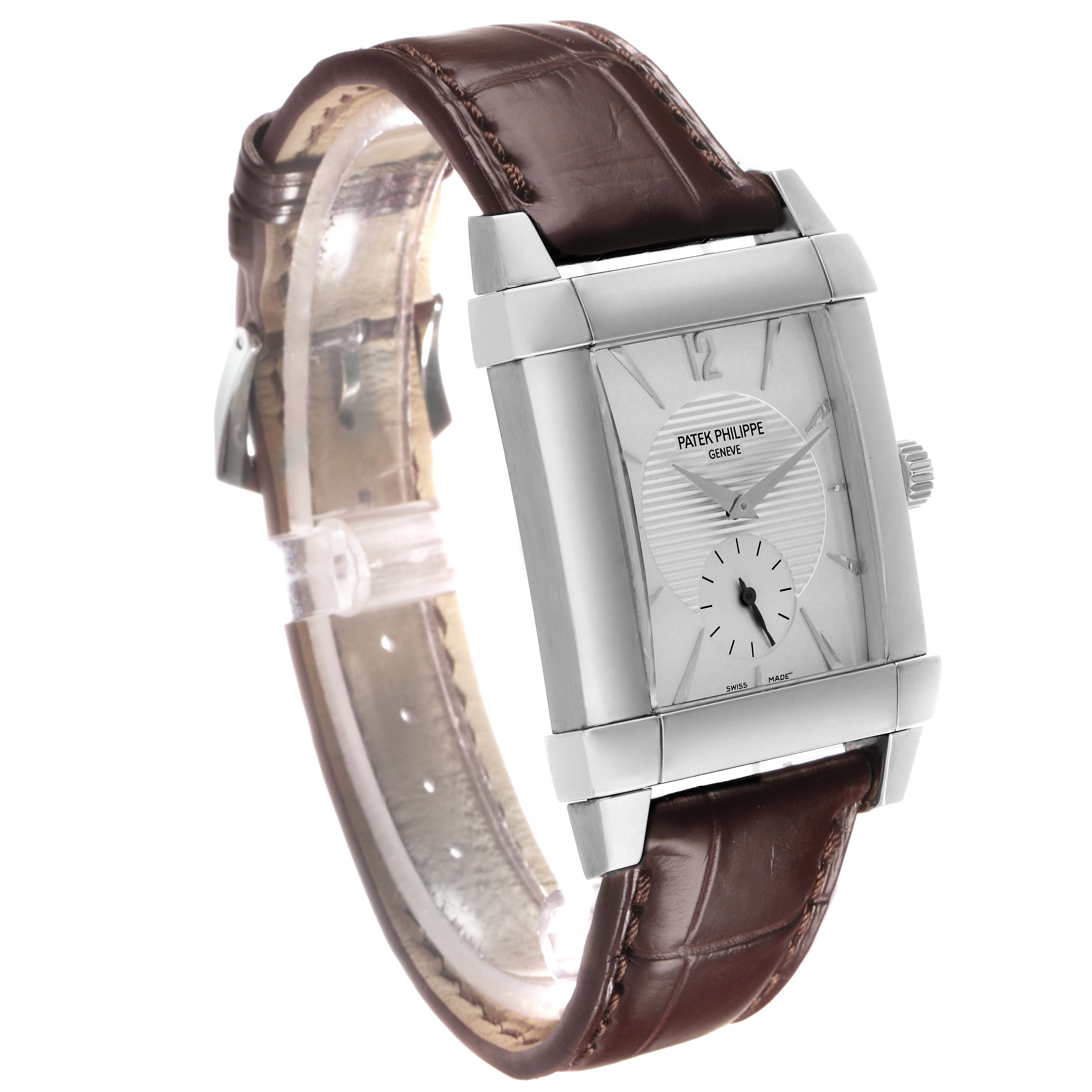 The Patek Philippe Gondolo 5111G Men's White Gold Silver Dial watch is shown at a three-quarter angle, highlighting its rectangular case, leather strap, and dial details.