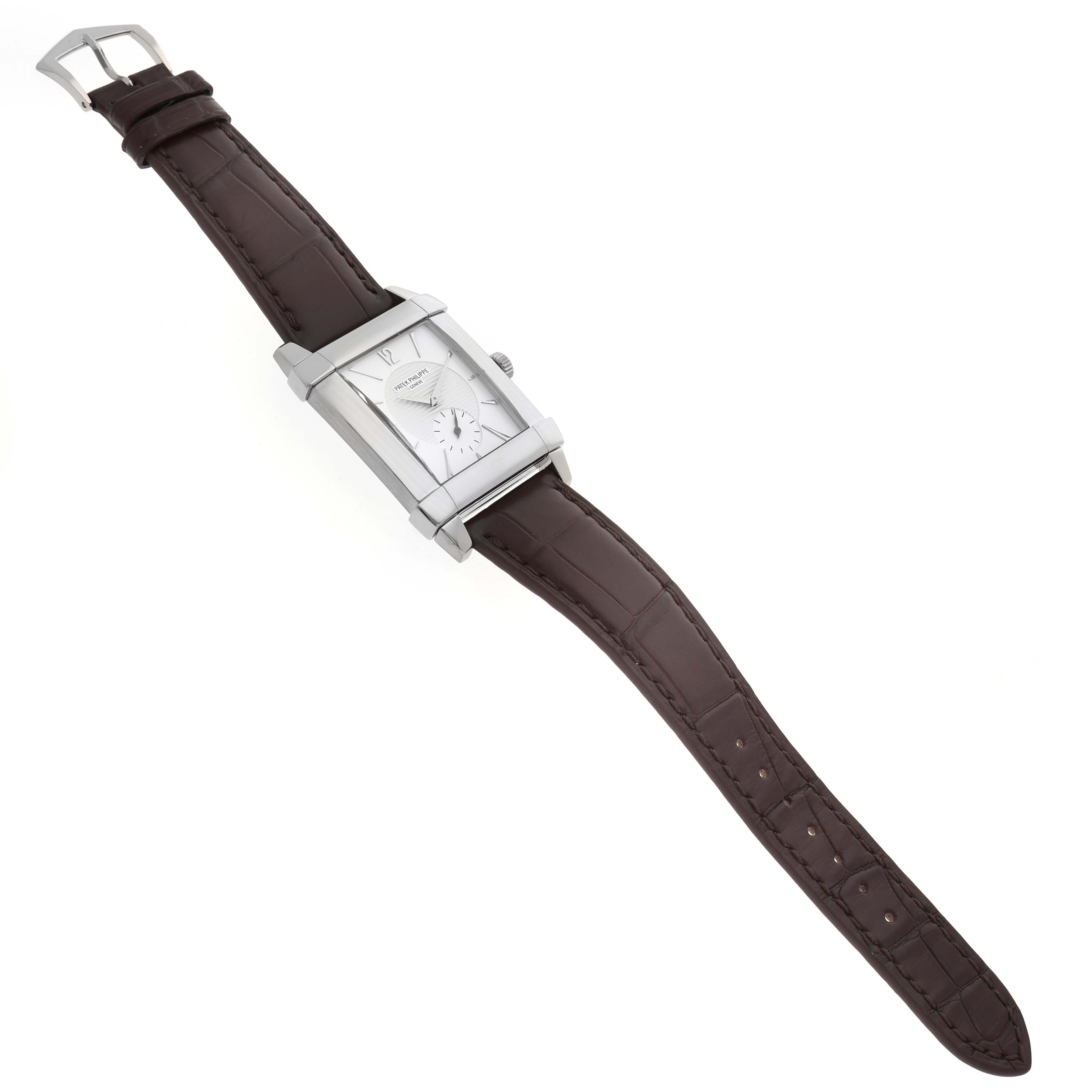 The Patek Philippe Gondolo 5111G Men's White Gold Silver Dial watch is shown at an elevated angle, displaying the face, case, and brown leather strap.