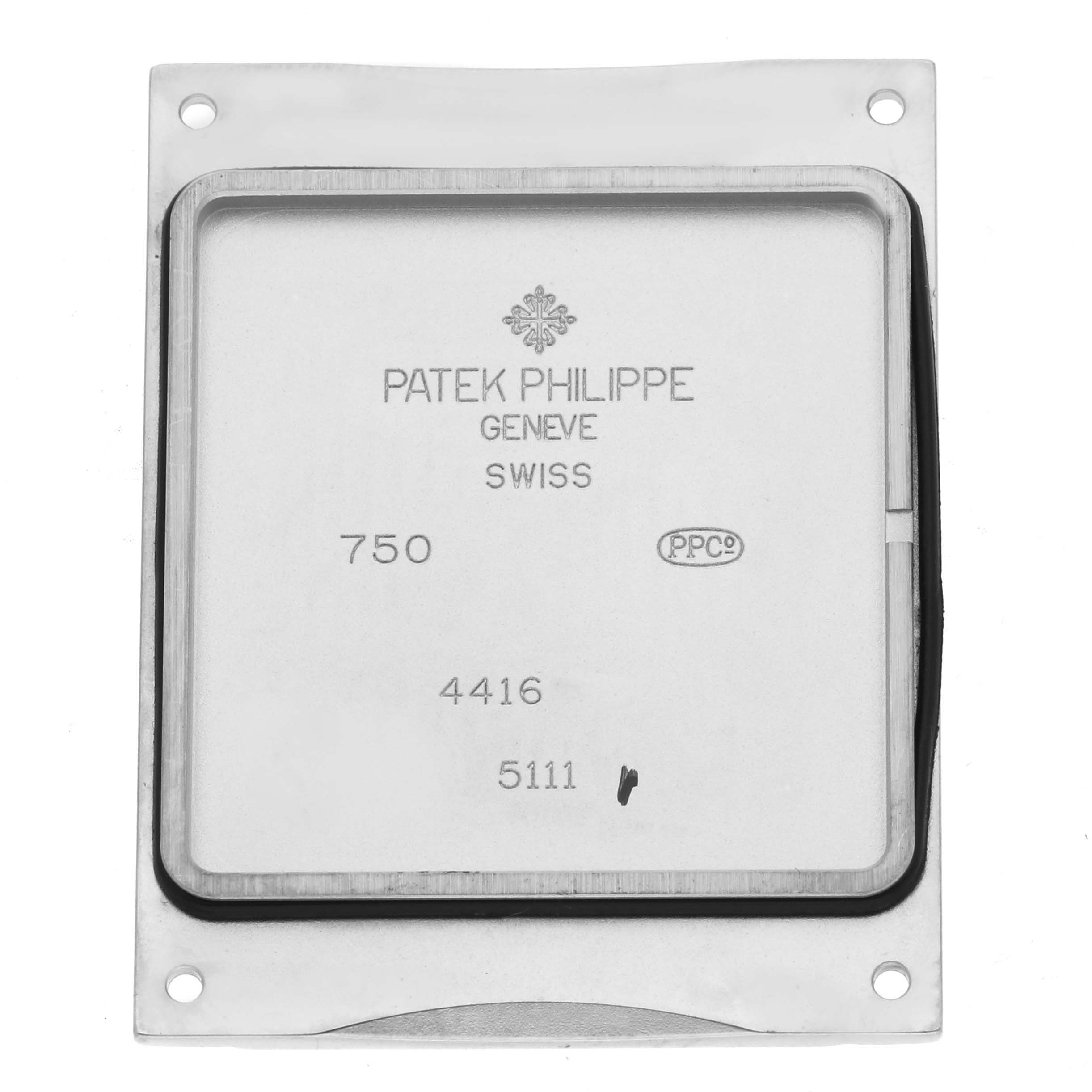 The image shows the backside of a Patek Philippe Gondolo 5111G Men's White Gold Silver Dial watch case, displaying its engravings and markings.