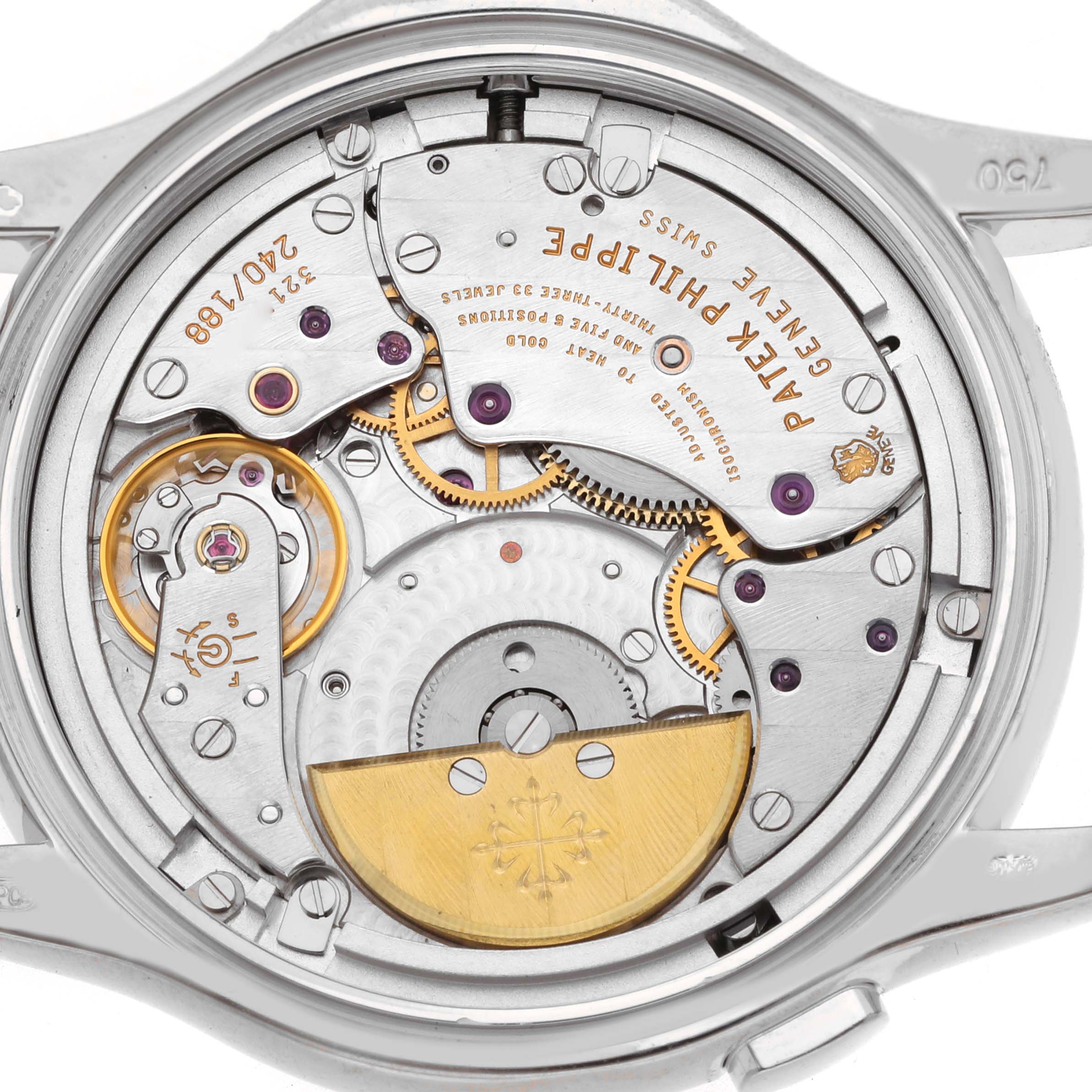 The image shows the movement from the back of the Patek Philippe Complications 5110G Men's White Gold Silver Dial watch, featuring gears and the rotor.