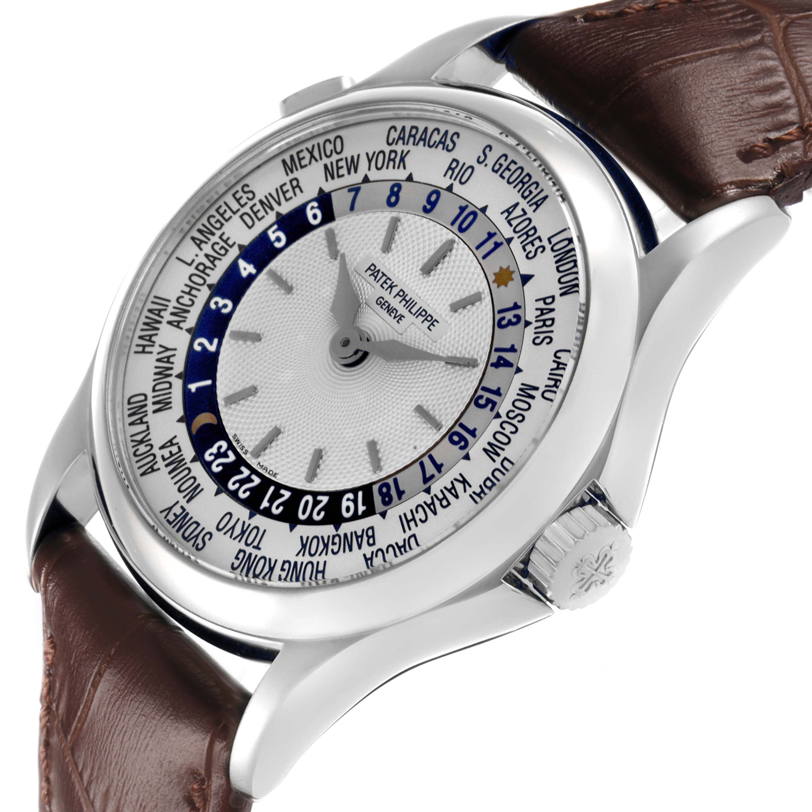The Patek Philippe Complications 5110G Men's White Gold Silver Dial watch is shown at a three-quarter angle, highlighting the dial, crown, and brown leather strap.