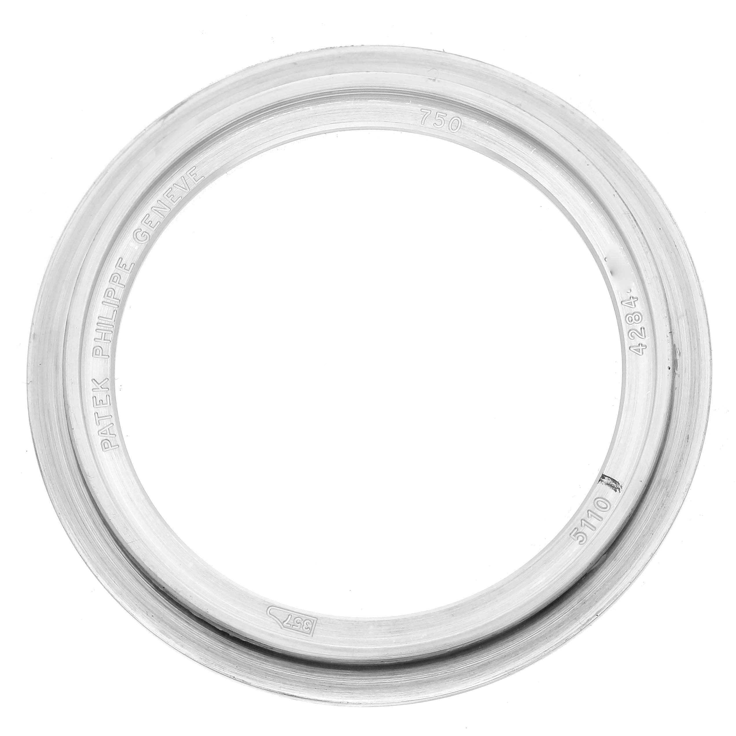 The image shows a Patek Philippe Complications 5110G Men's White Gold Silver Dial model watch bezel, viewed from above, displaying engravings and model details.