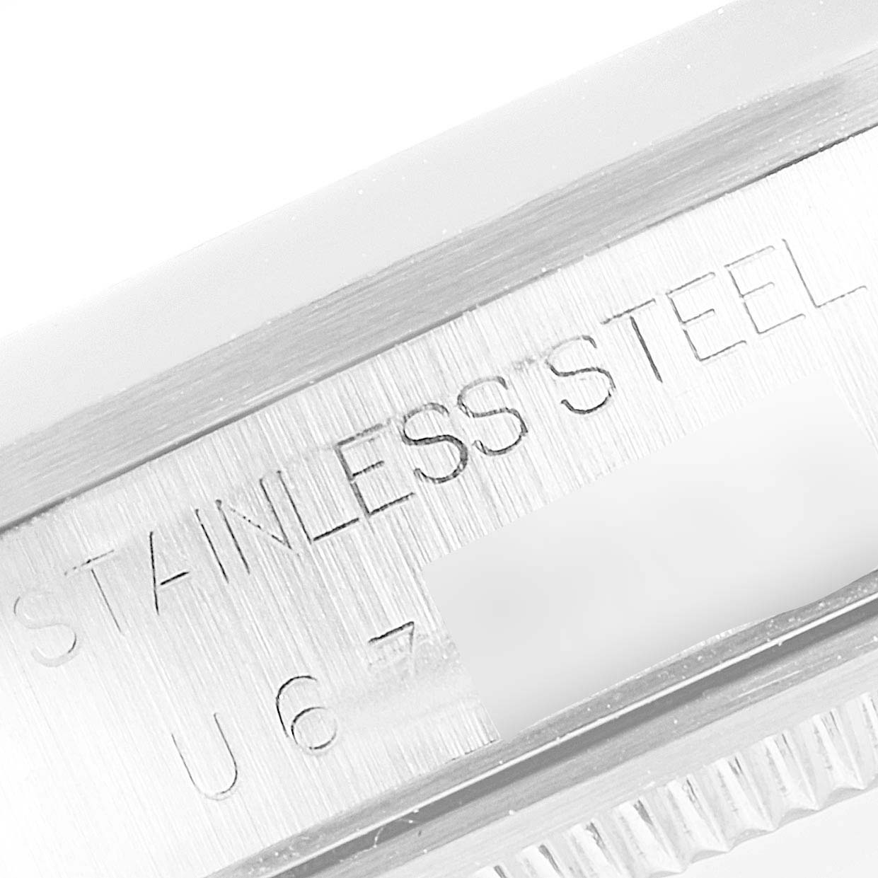 The image shows a close-up of the stainless steel case back with engravings of a Rolex Air-King 14000 Men's Stainless Steel Black Dial 14000 Men's Stainless Steel Black Dial watch.