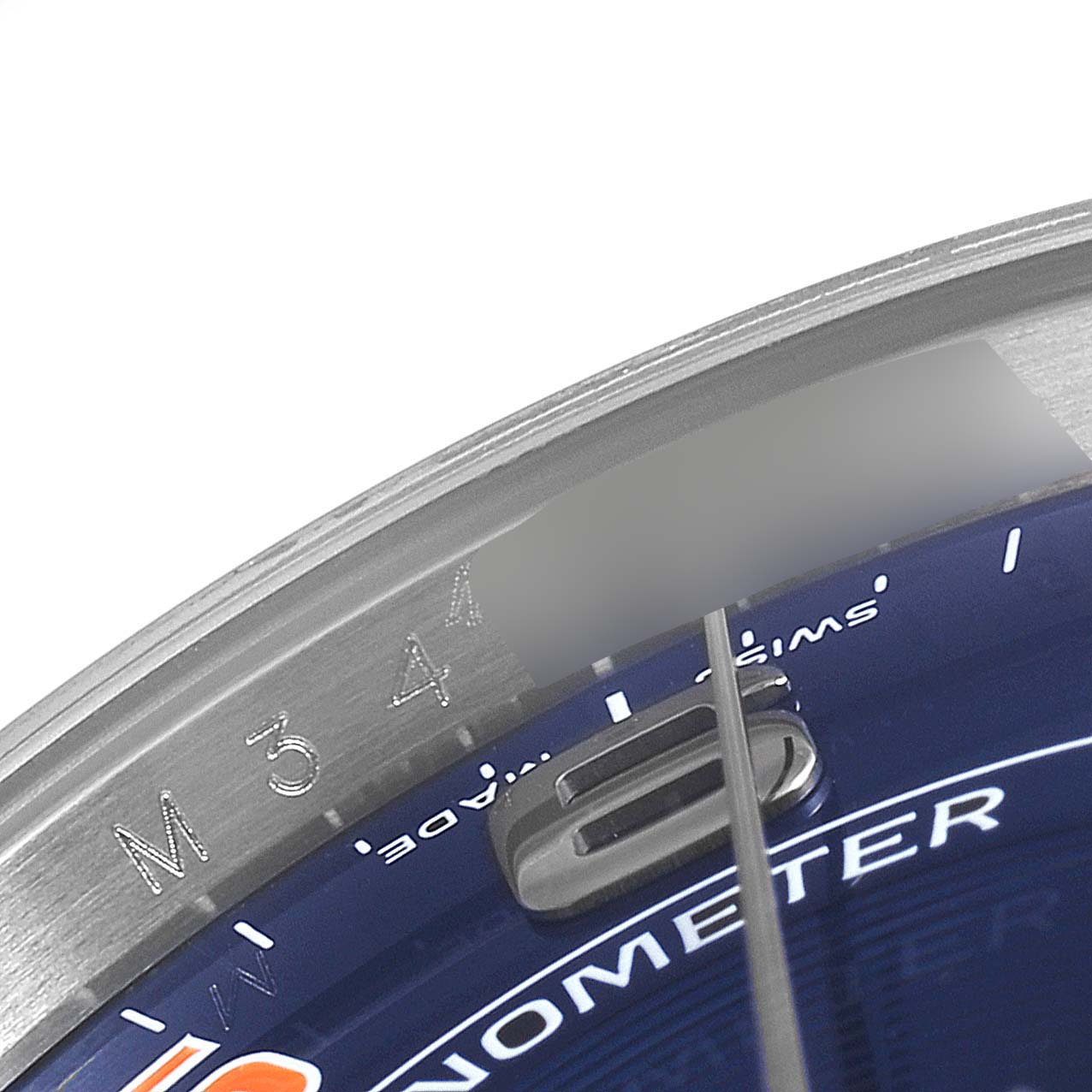 This is a close-up of the dial and part of the bezel of the Rolex Air-King 114234 Men's Stainless Steel Blue Dial 114234 Men's Stainless Steel Blue Dial watch, showing a portion of the numerals and the text.