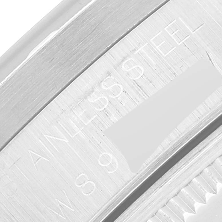 This image shows a close-up of the side rim engraving on a Rolex Air-King 14010 Men's Stainless Steel Grey Dial 14010 Men's Stainless Steel Grey Dial watch, highlighting the stainless steel marking and partial serial number.