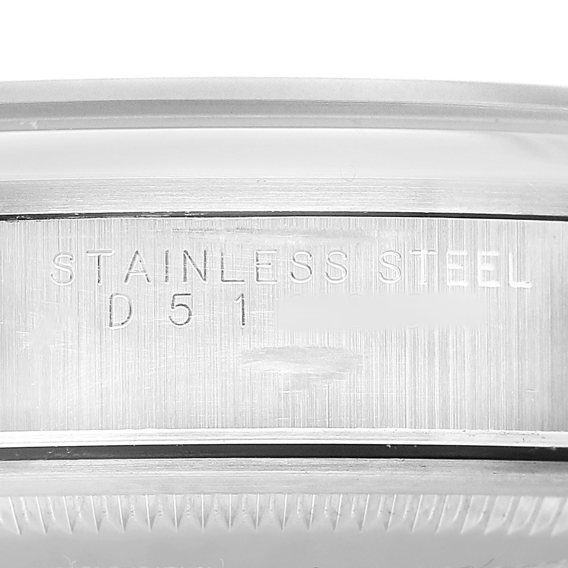 The image shows a close-up side view of the case edge of a Rolex Air-King 14000 Men's Stainless Steel Black Dial, highlighting the "STAINLESS STEEL" engraving.