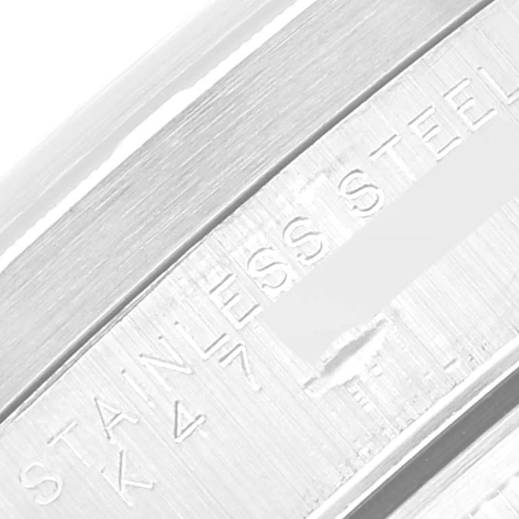 This image shows a close-up of the stainless steel band with engraved text of a Rolex Air-King 14010 Men's Stainless Steel Black Dial 14010 Men's Stainless Steel Black Dial watch.