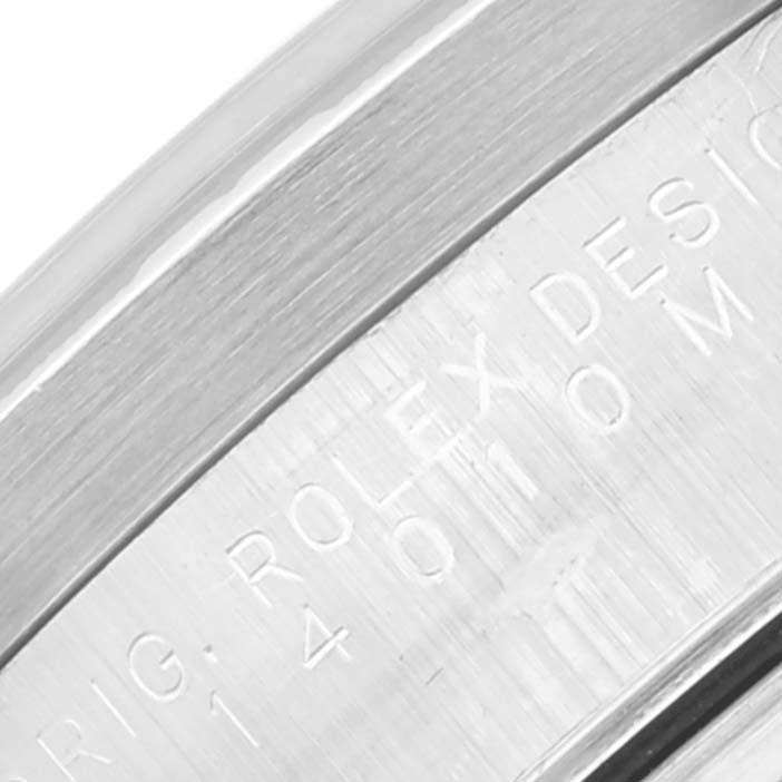 The image shows a close-up of the caseback edge of a Rolex Air-King 14010 Men's Stainless Steel Black Dial 14010 Men's Stainless Steel Black Dial model, highlighting the engraved text.