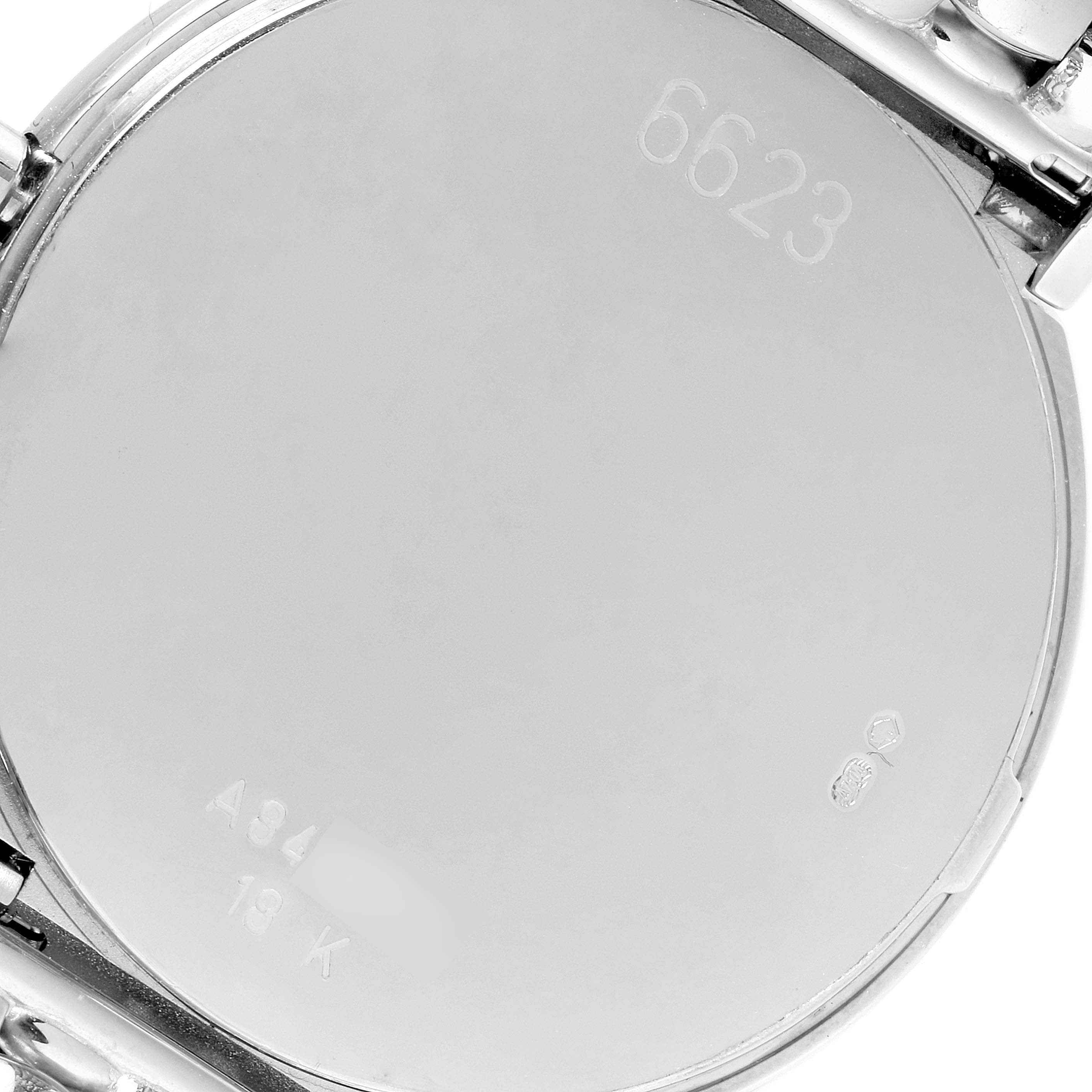 This image shows the case back of a Rolex Cellini 6623 Men's White Gold Mother of Pearl Dial 6623 Men's White Gold Mother of Pearl Dial model watch, highlighting engravings and markings.