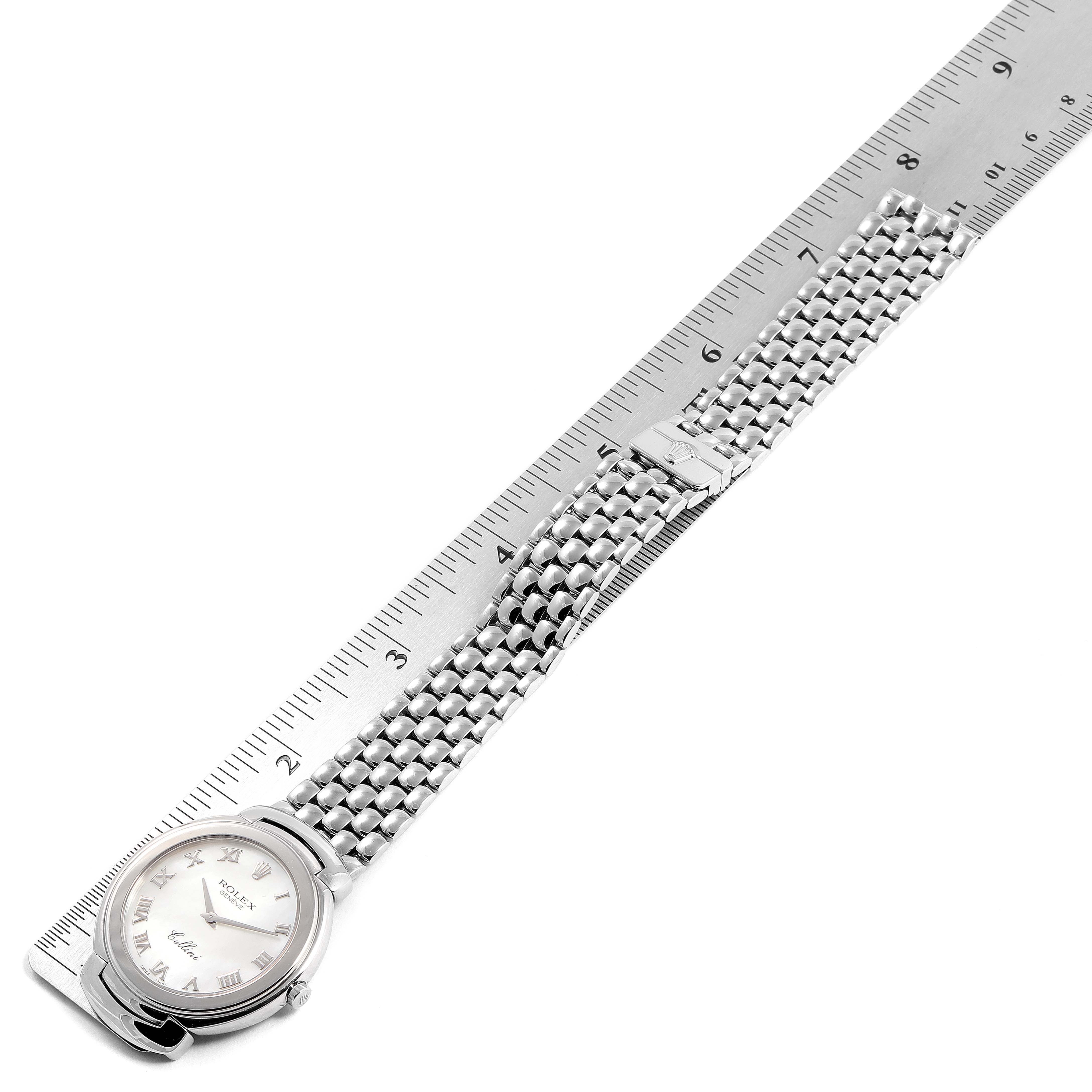 The image shows a Rolex Cellini 6623 Men's White Gold Mother of Pearl Dial 6623 Men's White Gold Mother of Pearl Dial watch laid flat against a ruler, with a focus on the face and metal bracelet.