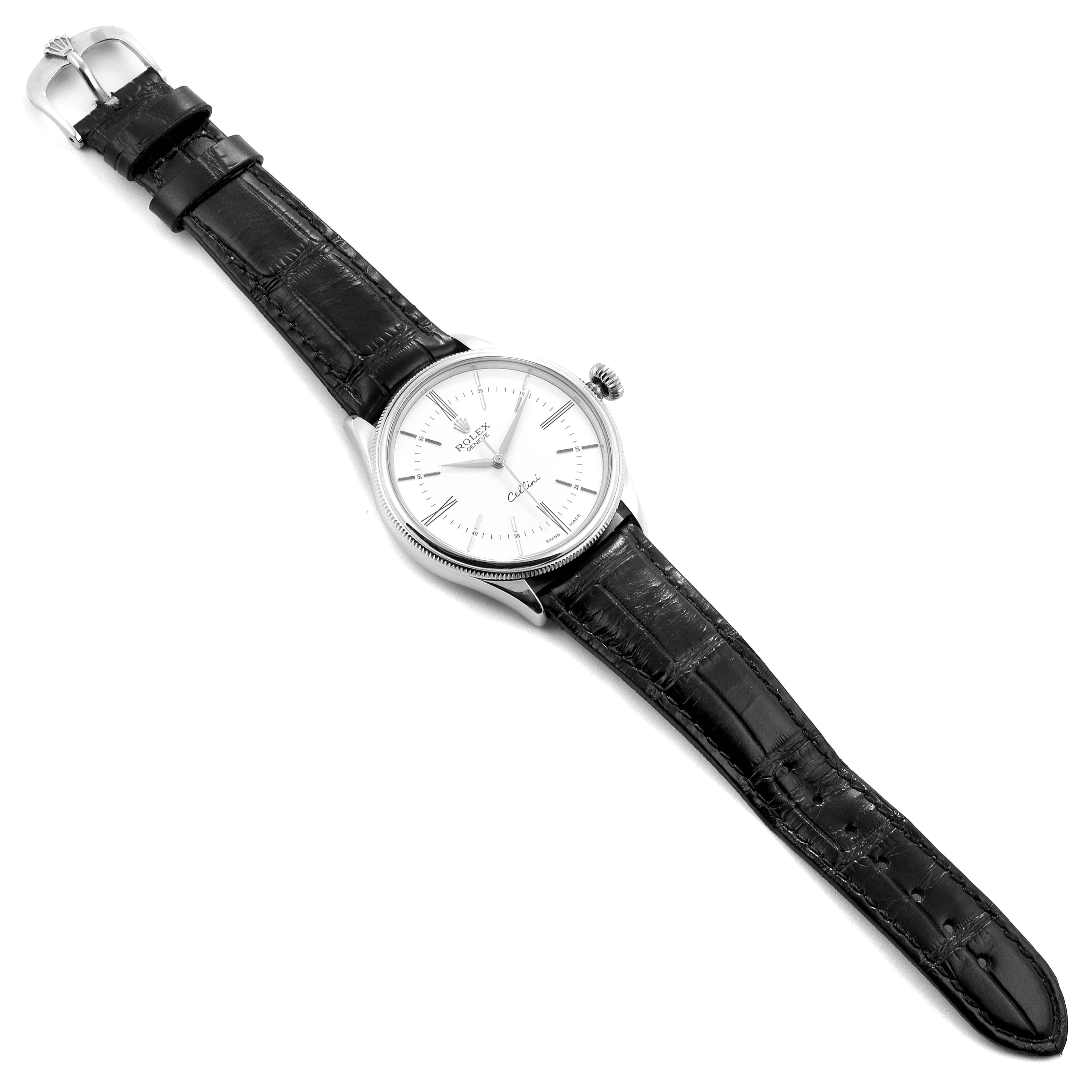 The Rolex Cellini 50509 Men
s White Gold White Dial 50509 Men
s White Gold White Dial watch is shown at a slight angle, displaying the dial, crown, and black leather strap.