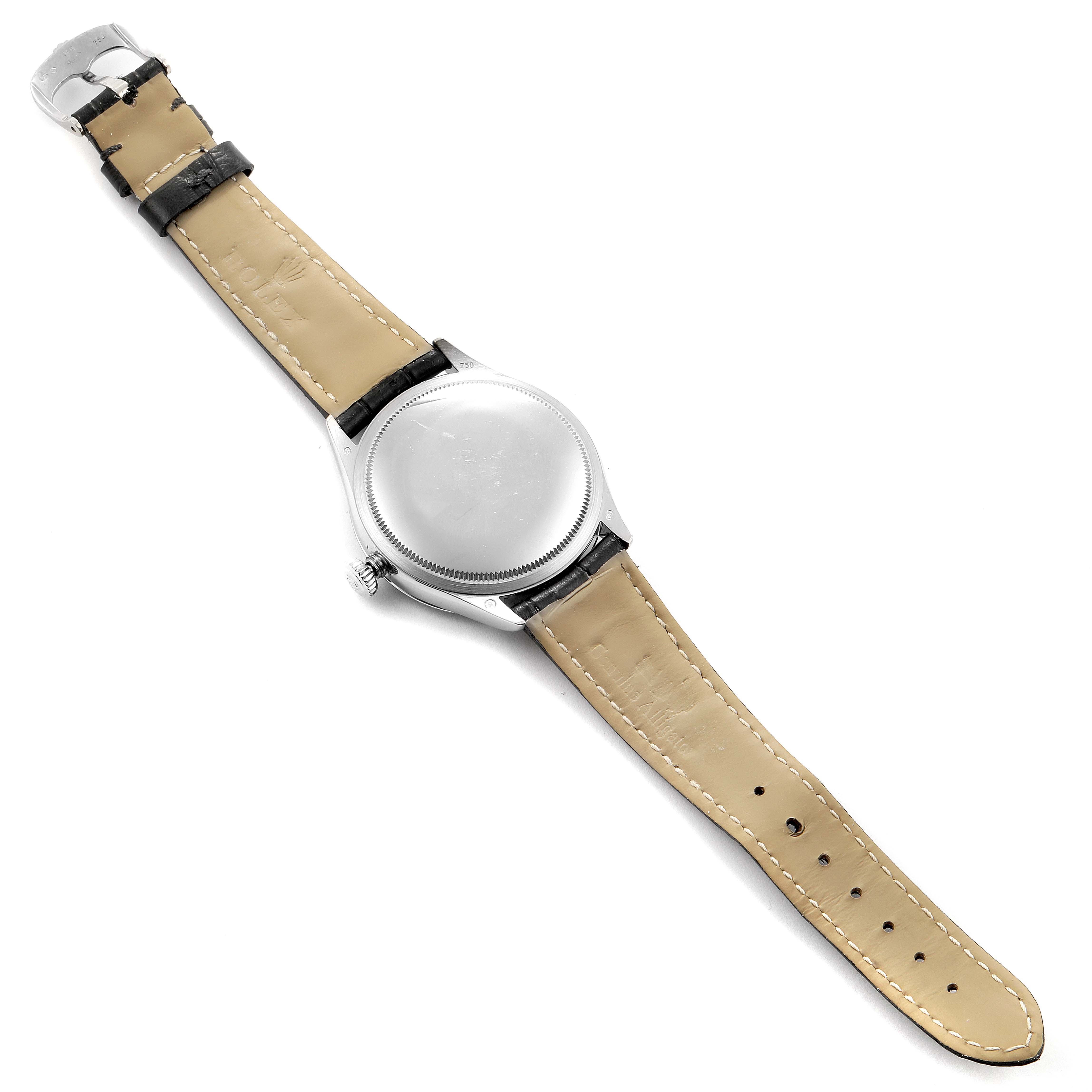 The image shows the back of the Rolex Cellini 50509 Men
s White Gold White Dial 50509 Men
s White Gold White Dial watch, including the case, crown, and leather straps.