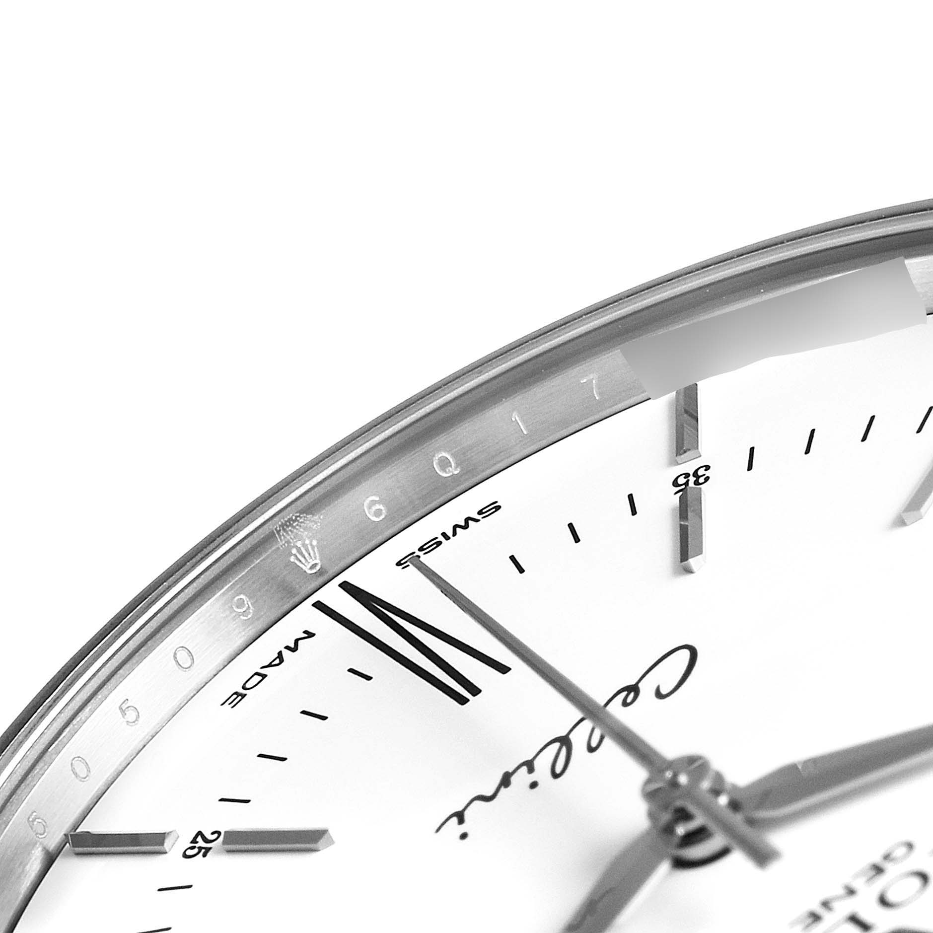 The image shows a close-up of the edge of a Rolex Cellini 50509 Men
s White Gold White Dial 50509 Men
s White Gold White Dial watch, highlighting part of the dial and bezel.