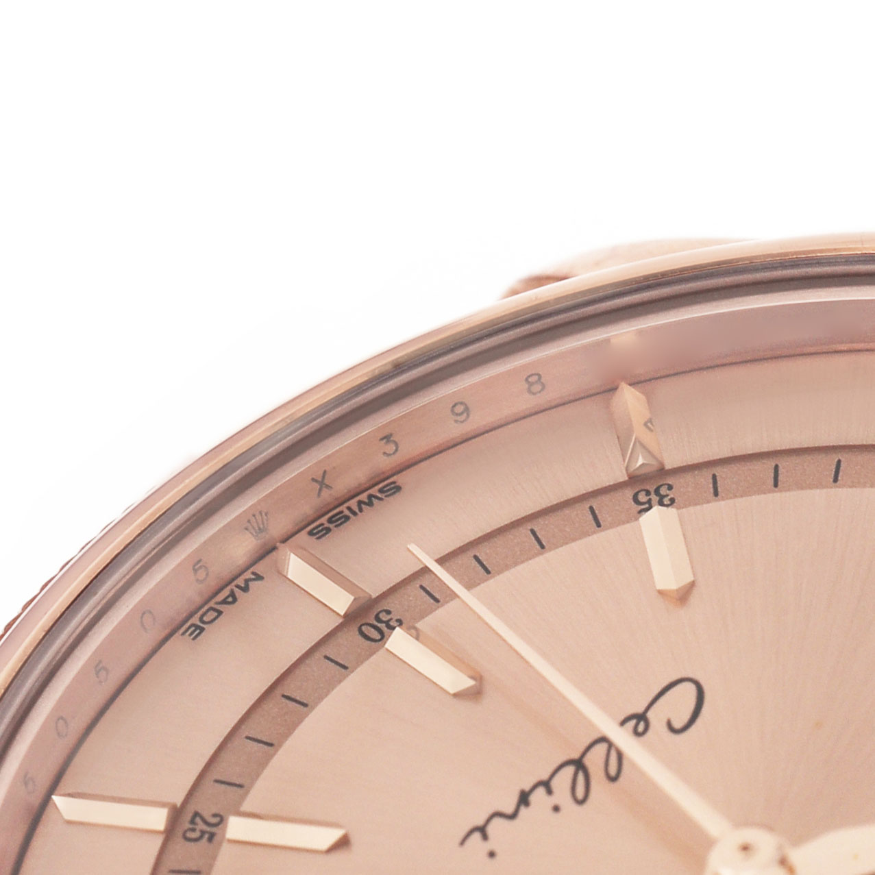 The image shows a close-up of the dial of a Rolex Cellini 50505 Men's Rose Gold Pink Dial, highlighting the indices and part of the minute track.