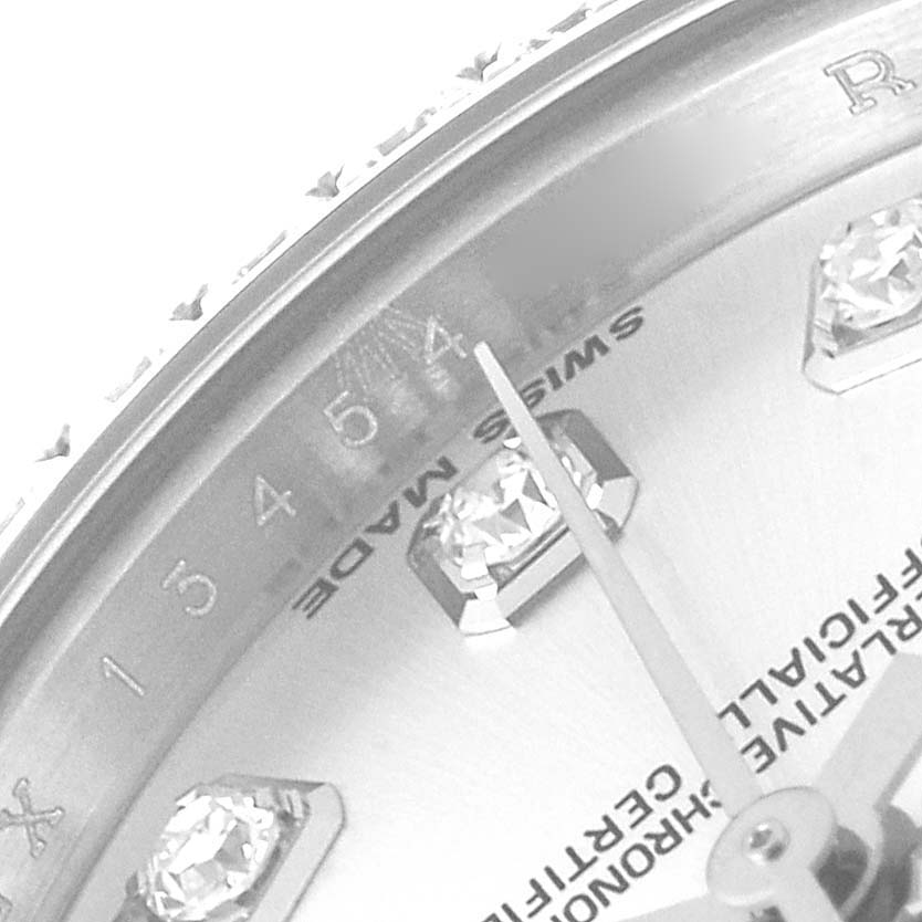 The image shows a close-up of the dial and bezel of a Rolex Datejust 179384 Women
s Stainless Steel Silver Dial 179384 Women
s Stainless Steel Silver Dial watch, highlighting the hour markers and "SWISS MADE" text.