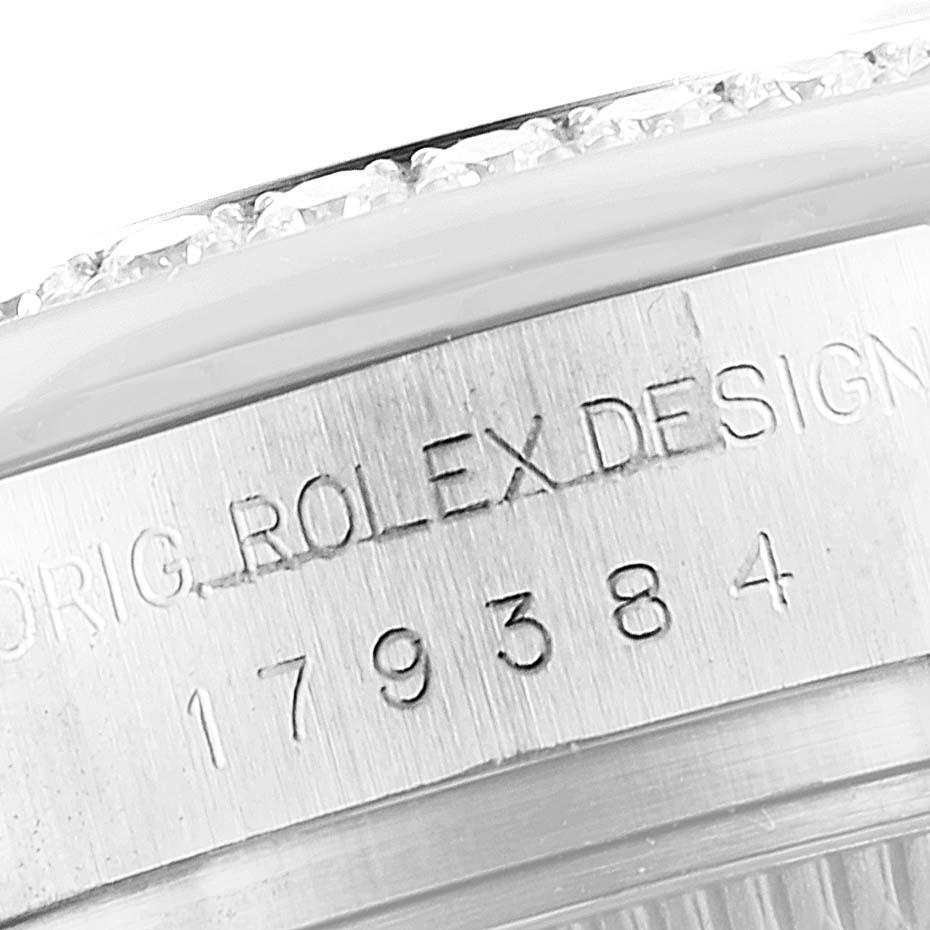This close-up image shows the side engraving on the case of a Rolex Datejust 179384 Women
s Stainless Steel Silver Dial 179384 Women
s Stainless Steel Silver Dial model, displaying its serial number.