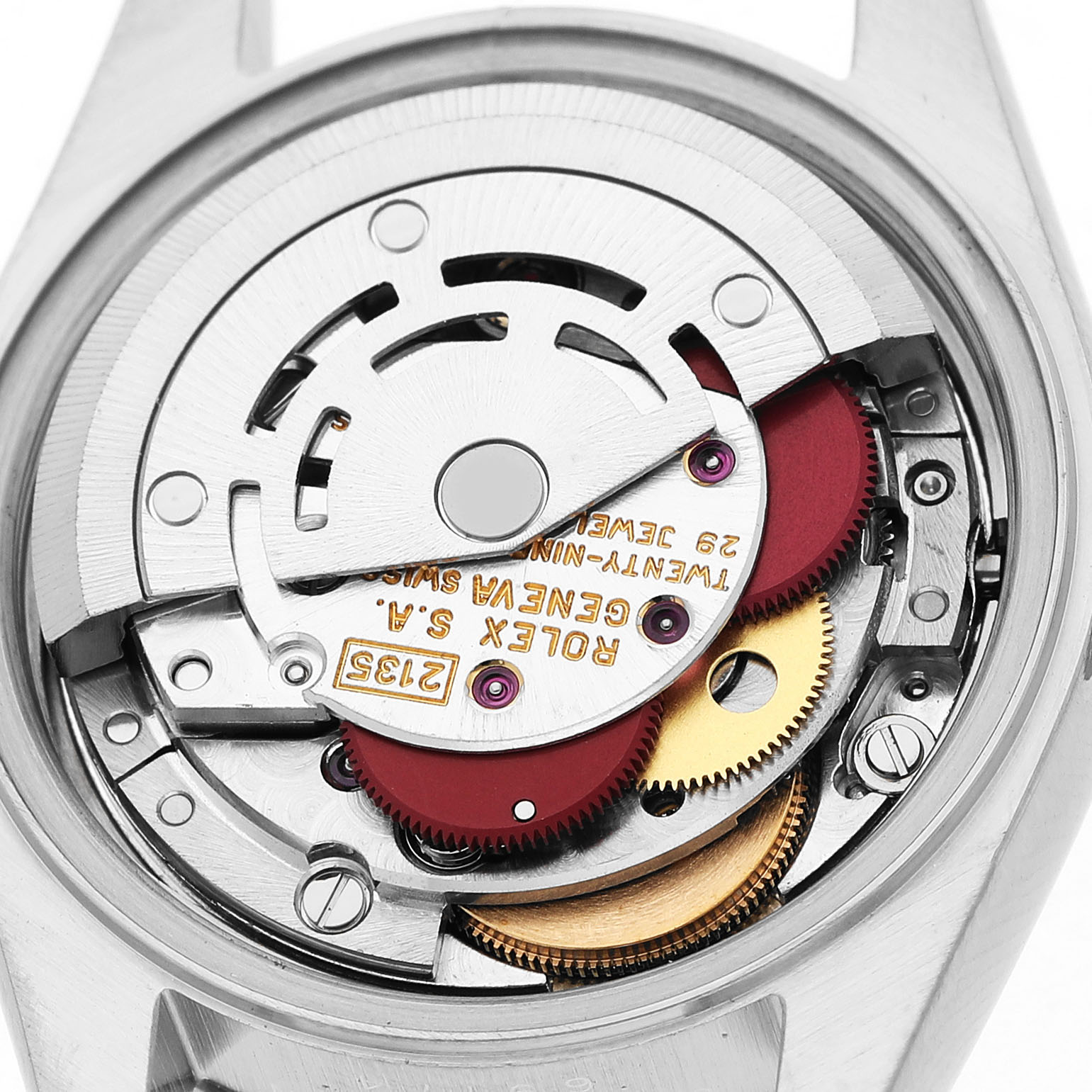 The image shows the movement of the Rolex Datejust 69174 Women's Stainless Steel White Dial watch with visible gears and inscriptions from a rear angle.
