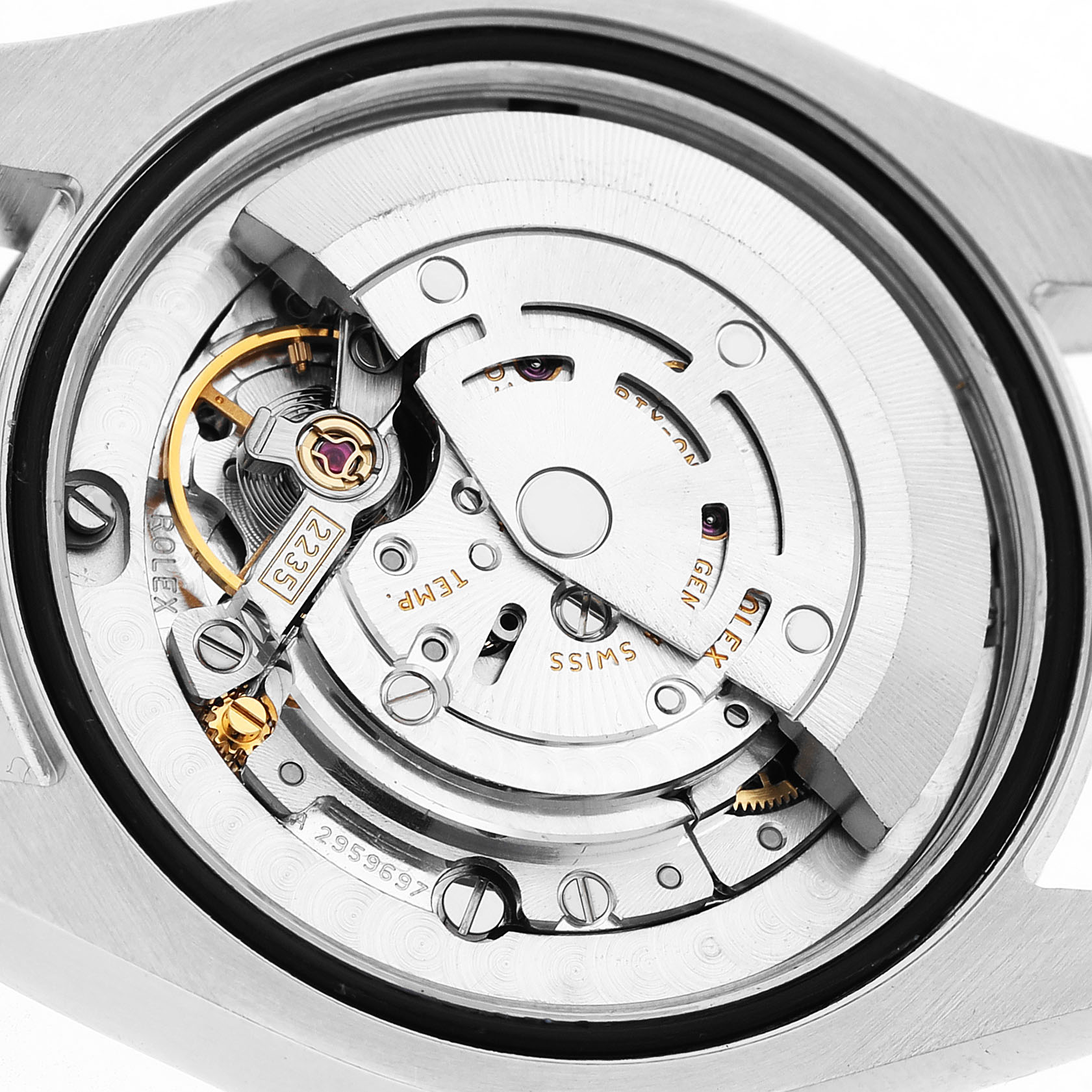 The image shows the movement mechanism of a Rolex Mid-Size 178243 Women's Steel and Gold (two tone) Black Dial model, viewed from the back with detailed gears and parts visible.