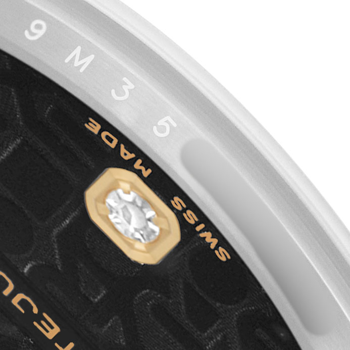 The image shows a close-up of a Rolex Mid-Size 178243 Women's Steel and Gold (two tone) Black Dial watch, focusing on the edge of the dial with "SWISS MADE" and part of the bezel.