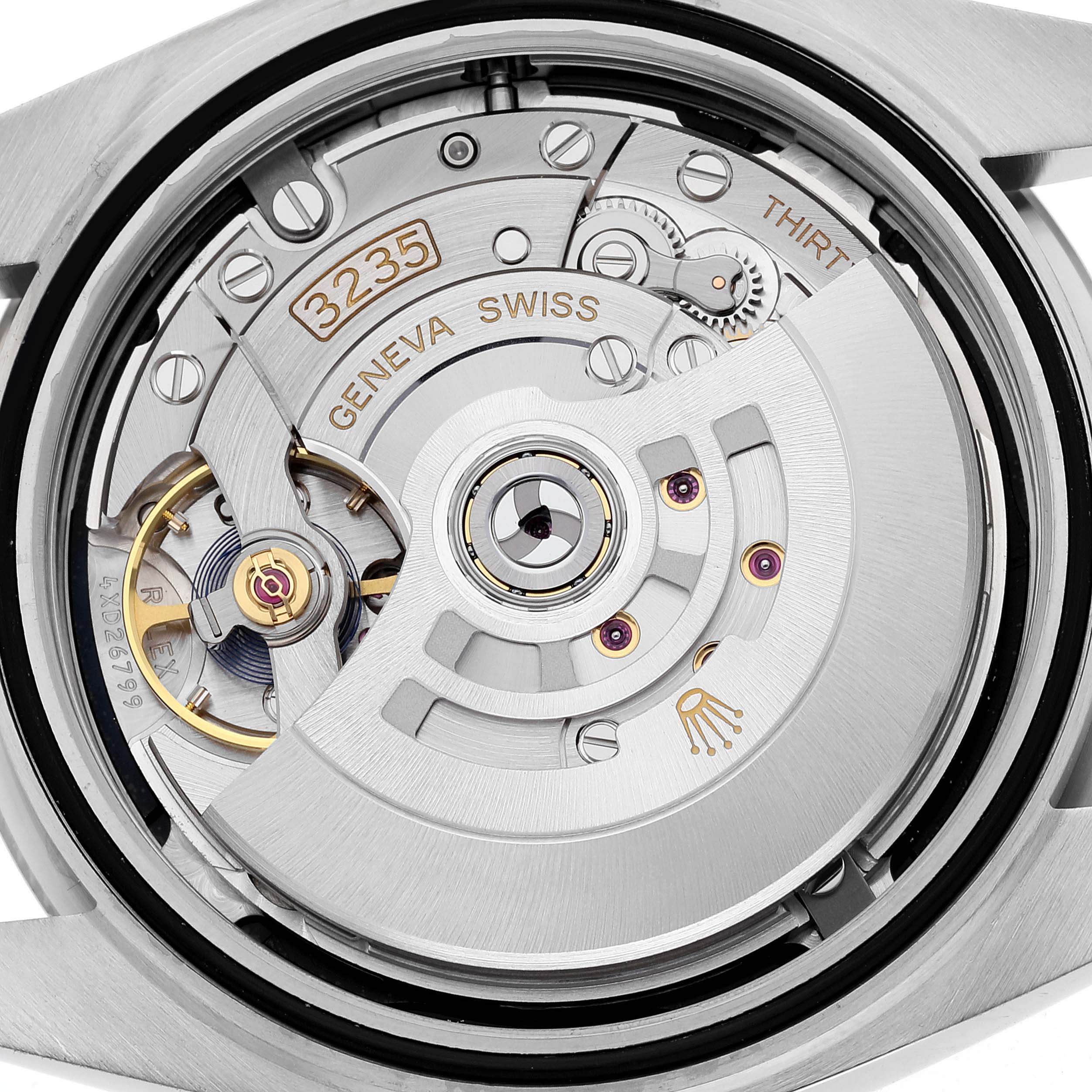 The image shows the mechanical movement and intricate inner workings of a Rolex Datejust 41 126334 Men
s Stainless Steel Black Dial 126334 Men
s Stainless Steel Black Dial watch from a close-up, rear angle.