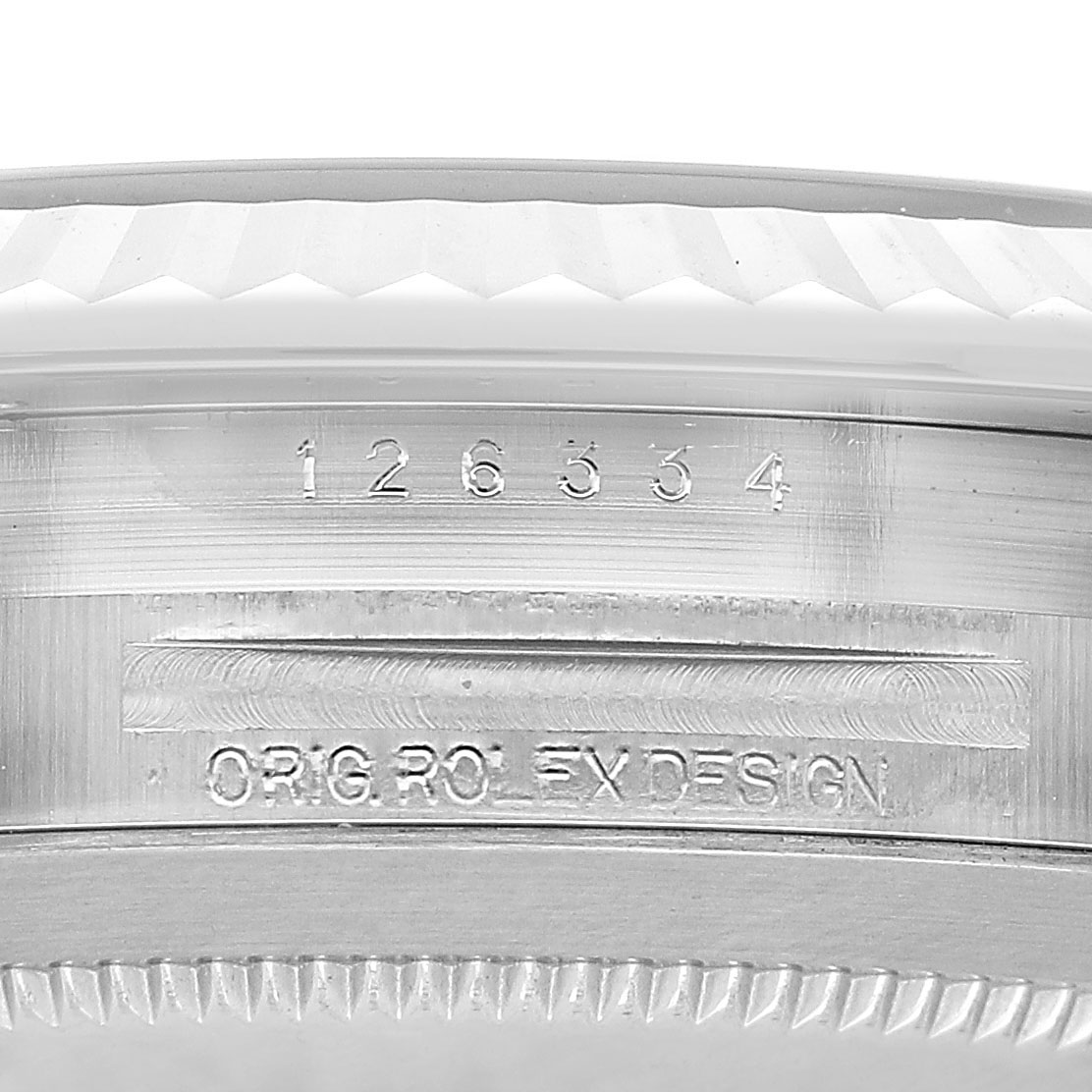 The image shows a close-up of the Rolex Datejust 41 126334 Men's Stainless Steel Green Dial's watch case edge, featuring engraved model details.