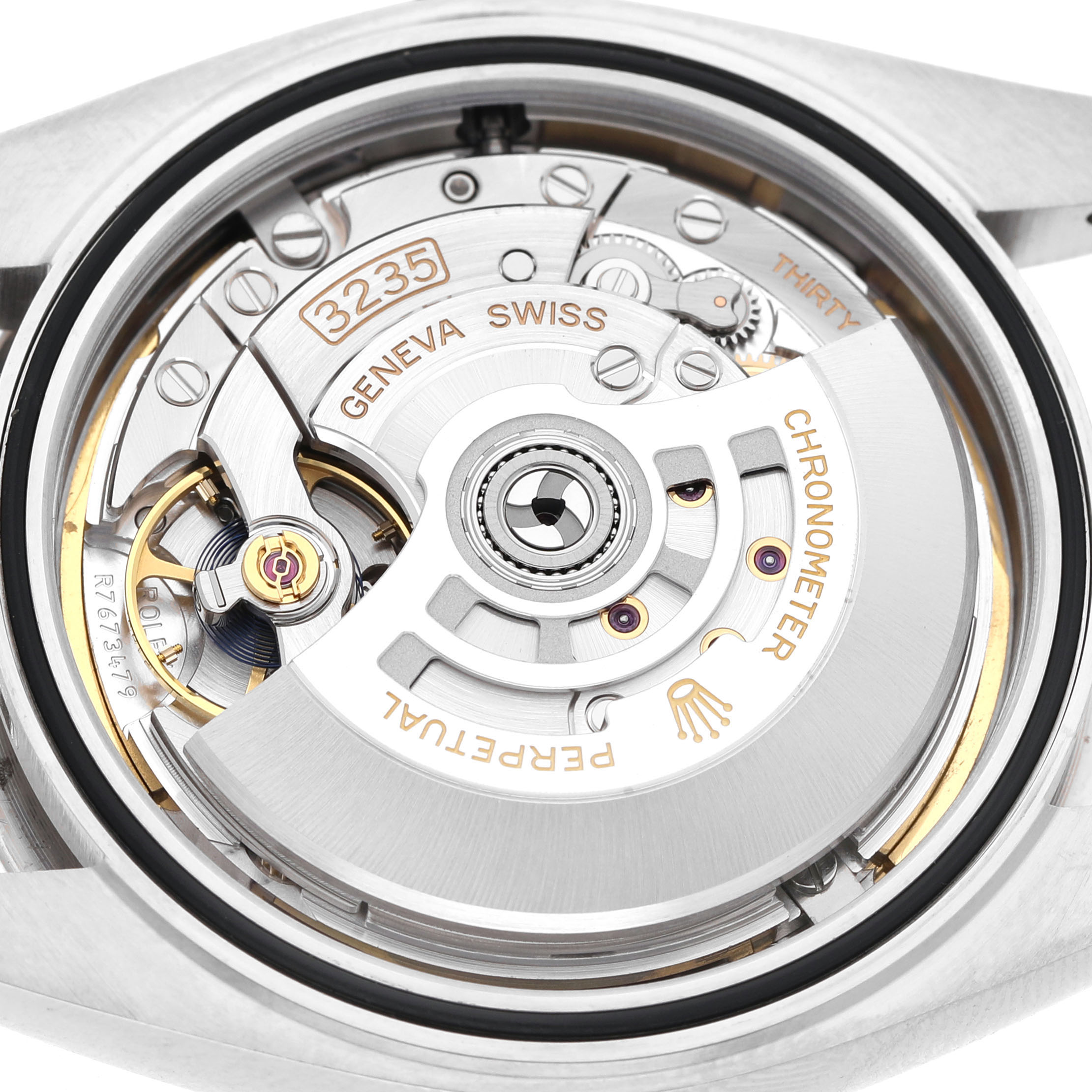 The image shows the movement of a Rolex Datejust 41 126334 Men's Stainless Steel Green Dial, viewed from the back, highlighting details like the rotor and engravings.