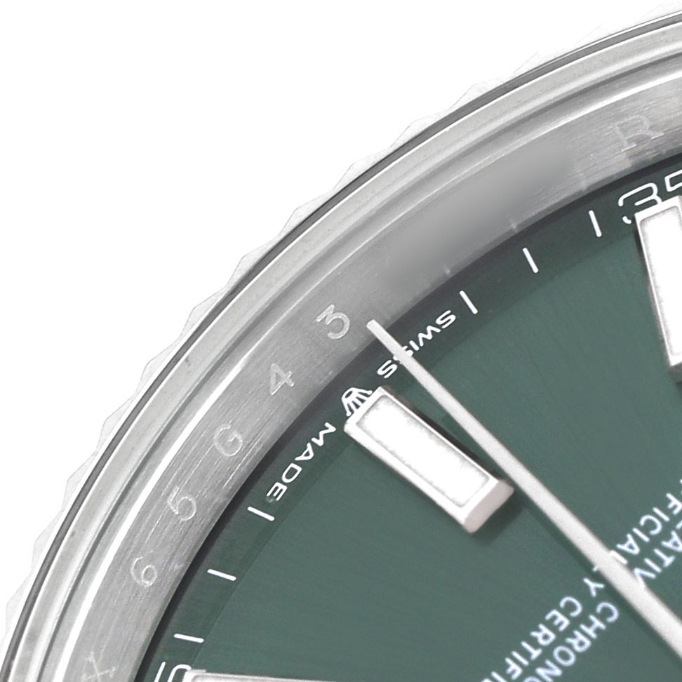 The image shows a partial close-up of the dial and bezel of a Rolex Datejust 41 126334 Men's Stainless Steel Green Dial with visible hour markers and minute indicators.