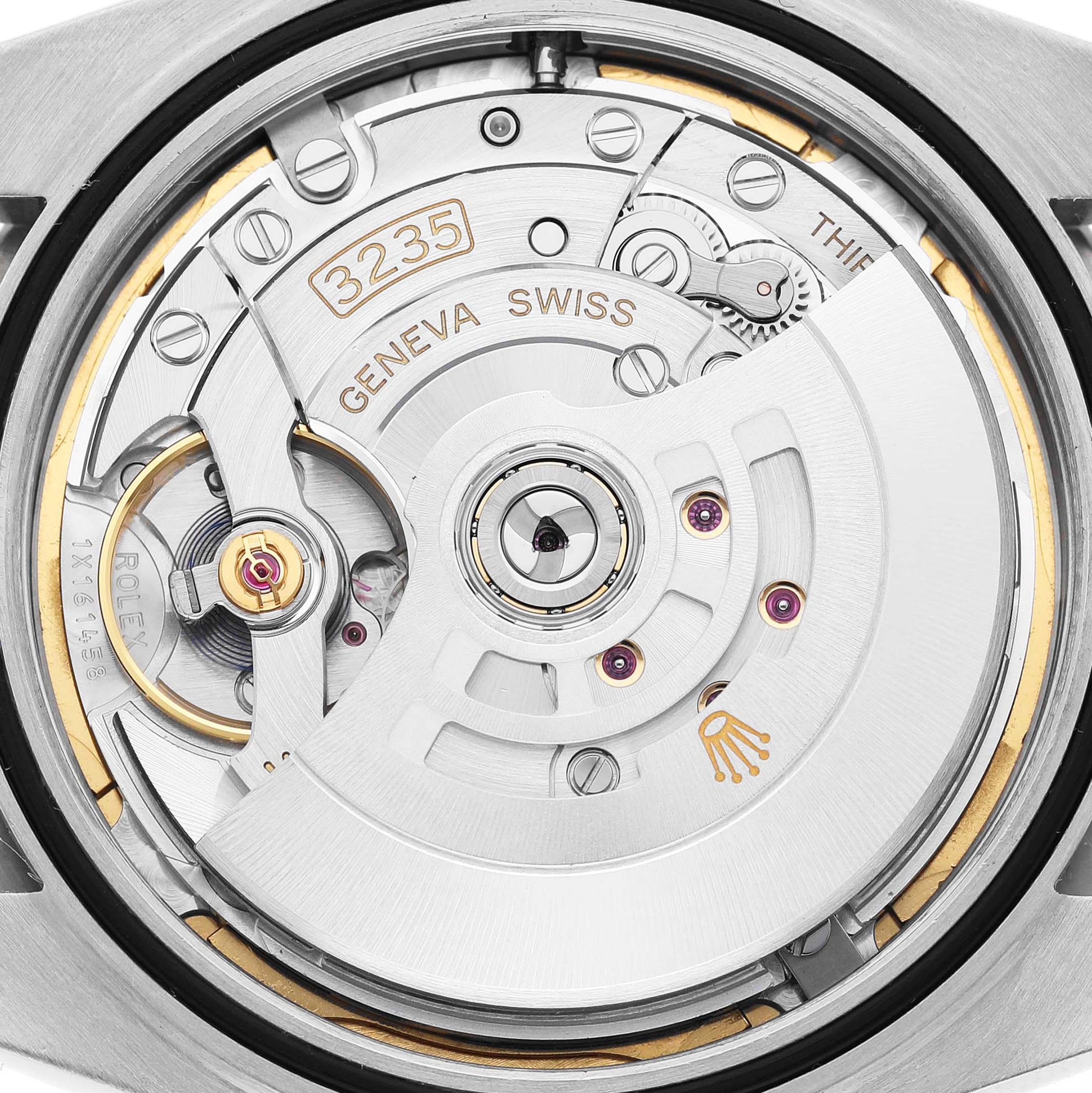 The image shows the internal mechanism of a Rolex Datejust 41 126334 Men's Stainless Steel Grey Dial, highlighting the rotor and movement components.