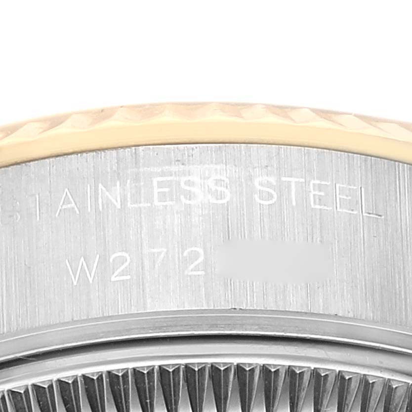 This close-up image shows the case and bezel of a Rolex Datejust 69173 Women's Steel and Gold (two tone) Black Dial 69173 Women's Steel and Gold (two tone) Black Dial watch, highlighting the engraving on the stainless steel.