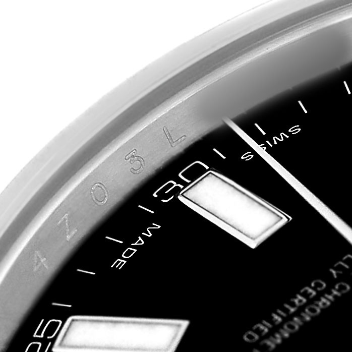 The image shows a close-up of the dial and markers of a Rolex Datejust 41 116334 Men's Stainless Steel Black Dial, focusing on the indices and part of the bezel.