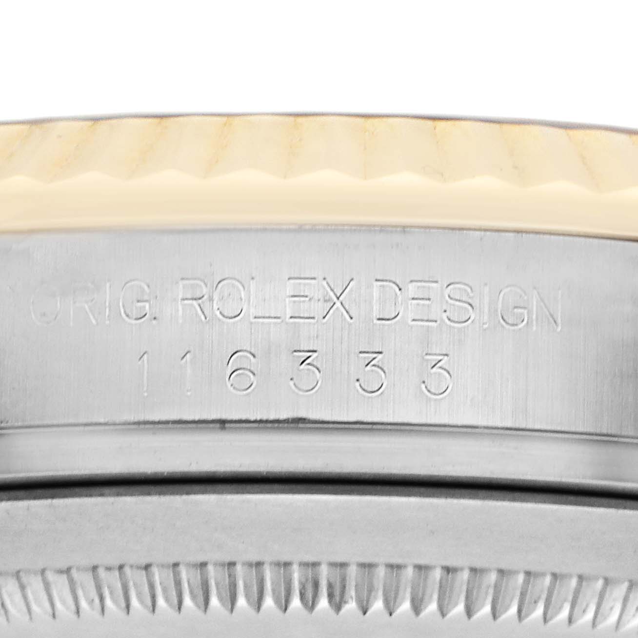 The image shows the side view of a Rolex Datejust 41 116333 Men's Steel and Gold (two tone) Champagne Dial, highlighting the engravings and a portion of the fluted bezel.