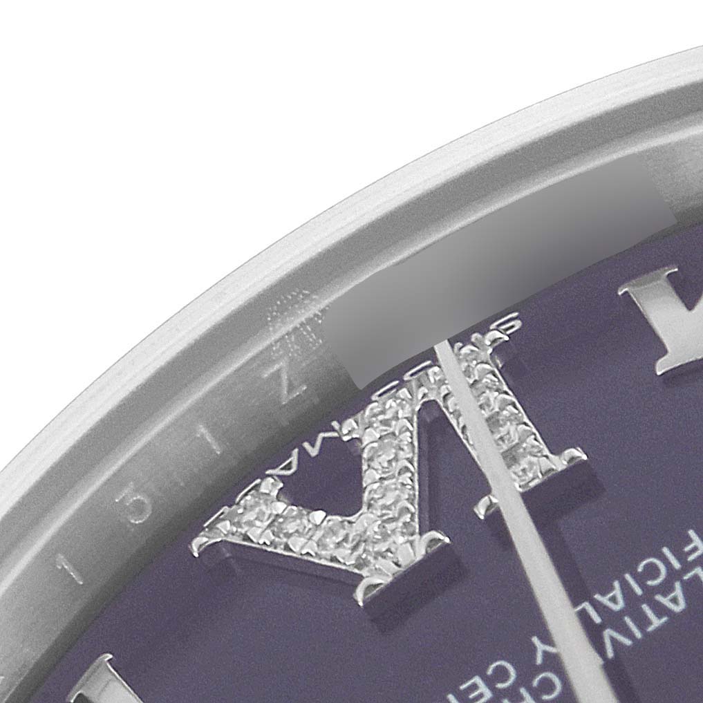 This image shows a close-up of the Roman numeral hour markers and edge of the dial on a Rolex Mid-Size 178274 Women's Stainless Steel Purple Dial 178274 Women's Stainless Steel Purple Dial watch.