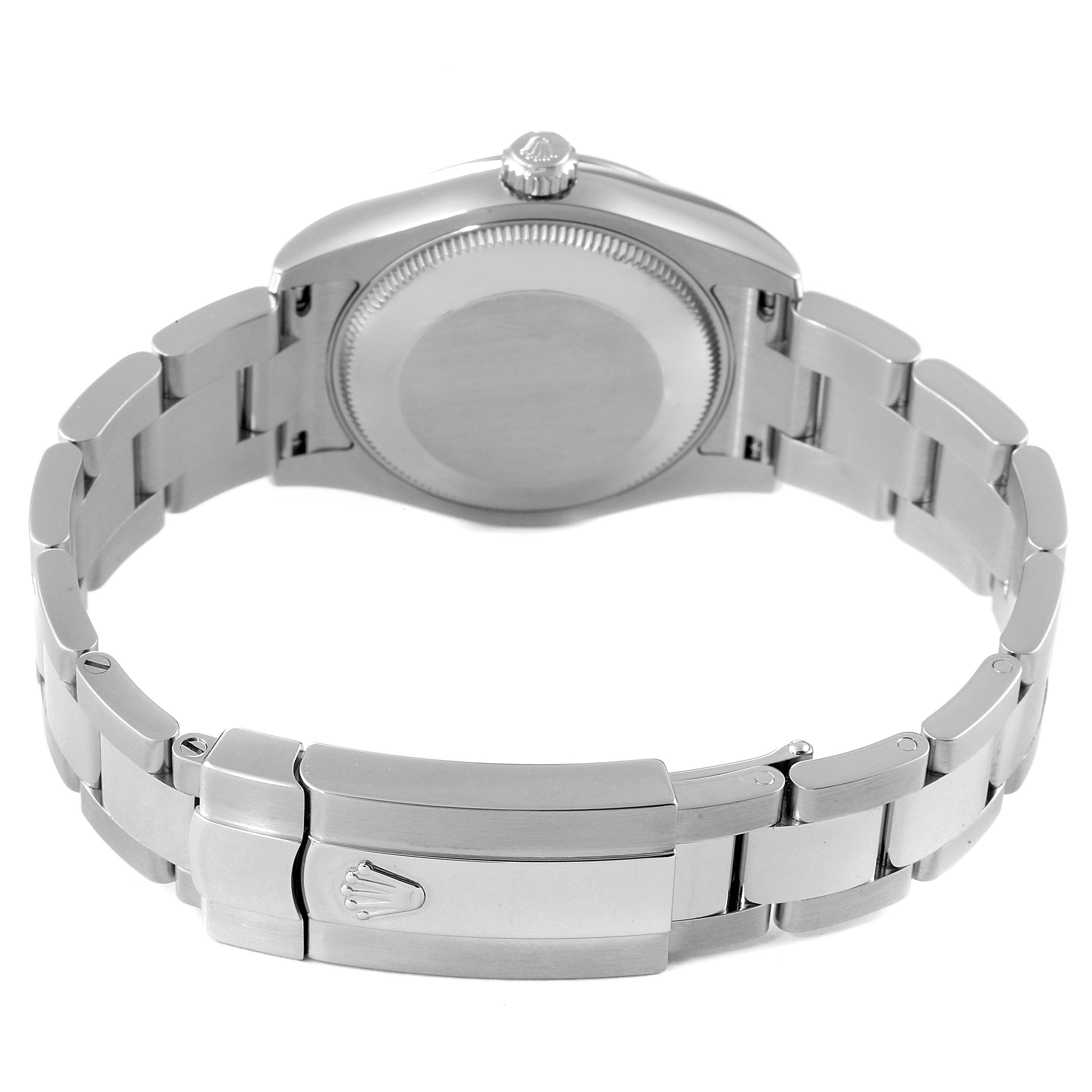 This image shows the back view of a Mid-Size Rolex watch, featuring the case back and metal bracelet with the clasp opened.