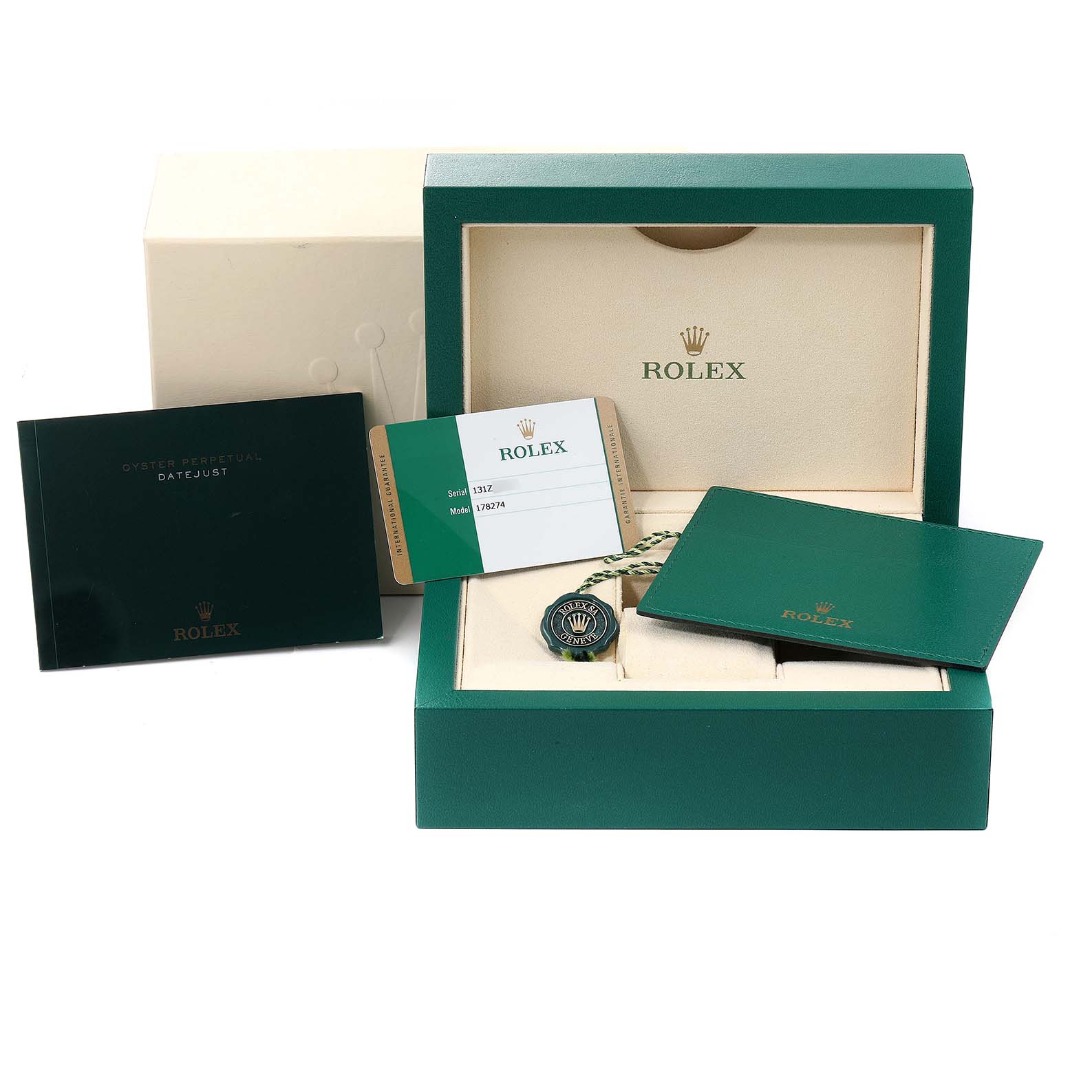 The image shows the Rolex Mid-Size 178274 Women's Stainless Steel Purple Dial 178274 Women's Stainless Steel Purple Dial watch box, warranty card, manuals, and a tag, all from a top-down angle.