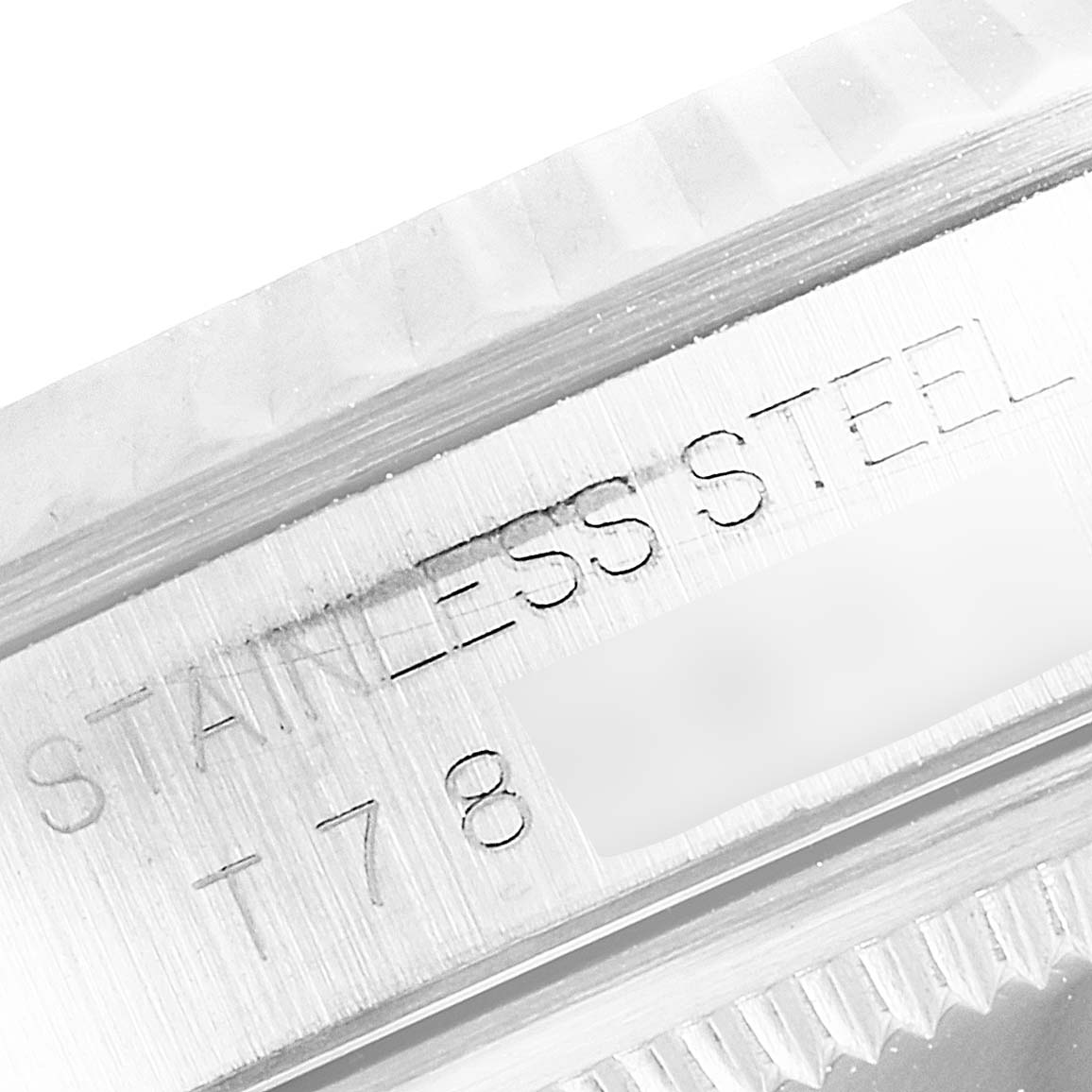 The image shows a close-up of the stainless steel engraving and part of the bezel of a Rolex Datejust 16234 Men's Stainless Steel Mother of Pearl Dial 16234 Men's Stainless Steel Mother of Pearl Dial watch.