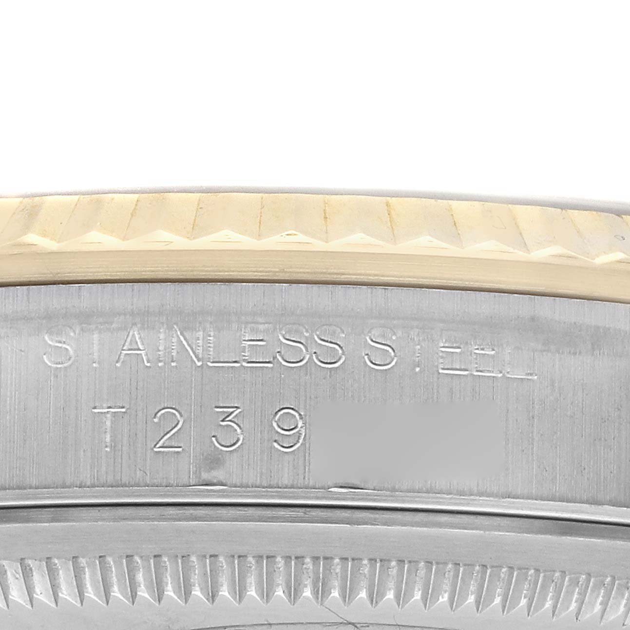 This image shows a close-up of the side of a Rolex Datejust 16233 Men's Steel and Gold (two tone) Champagne Dial watch, highlighting the stainless steel casing and part of the bezel inscription.