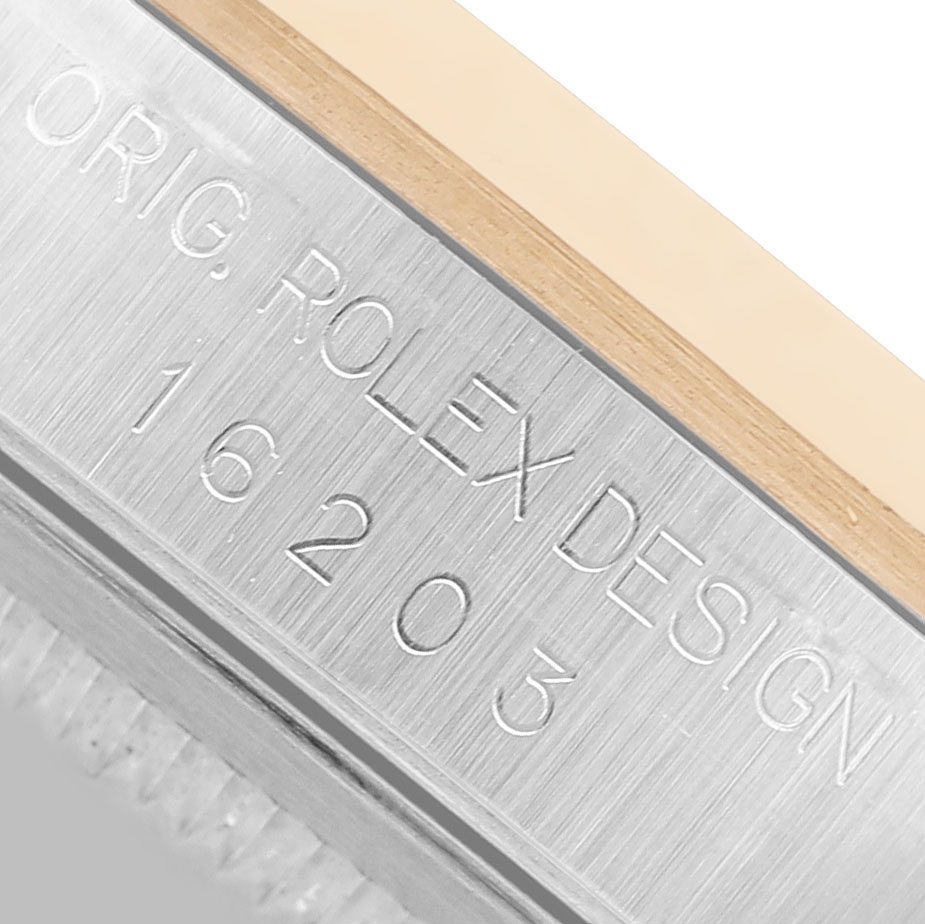 The image shows a close-up of the edge and model number engraving on the Rolex Datejust 16203 Men's Stainless Steel Champagne Dial.