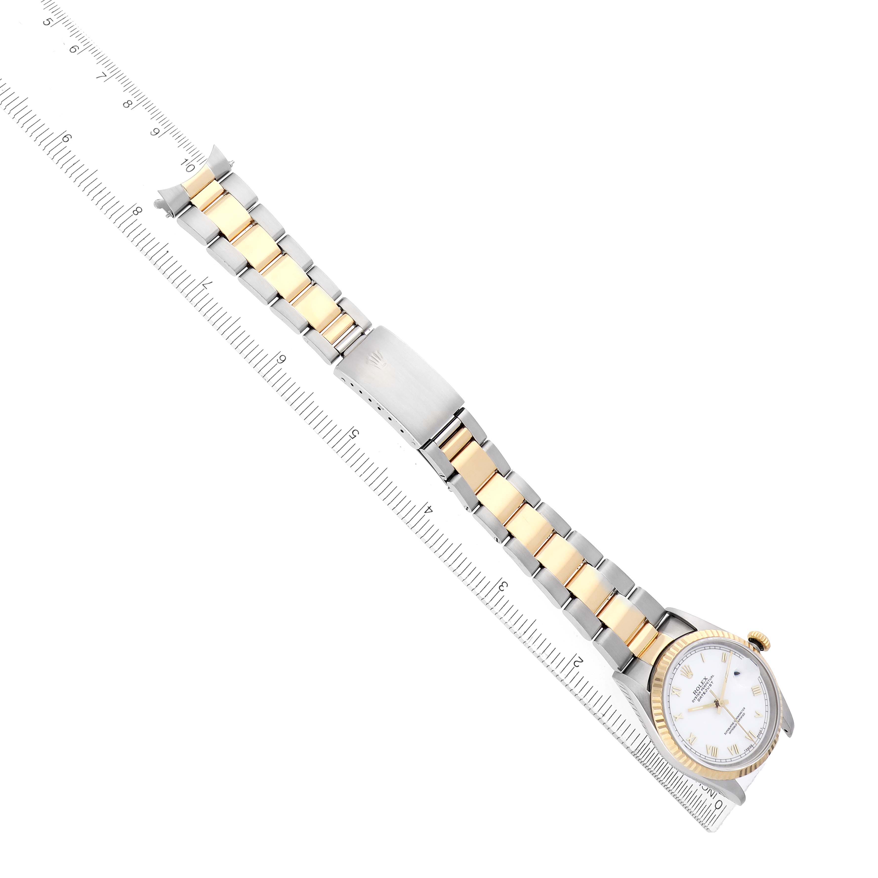 The Rolex Datejust 16233 Men's Steel and Gold (two tone) White Dial watch is shown diagonally, fully extended, with a focus on the bracelet and dial.