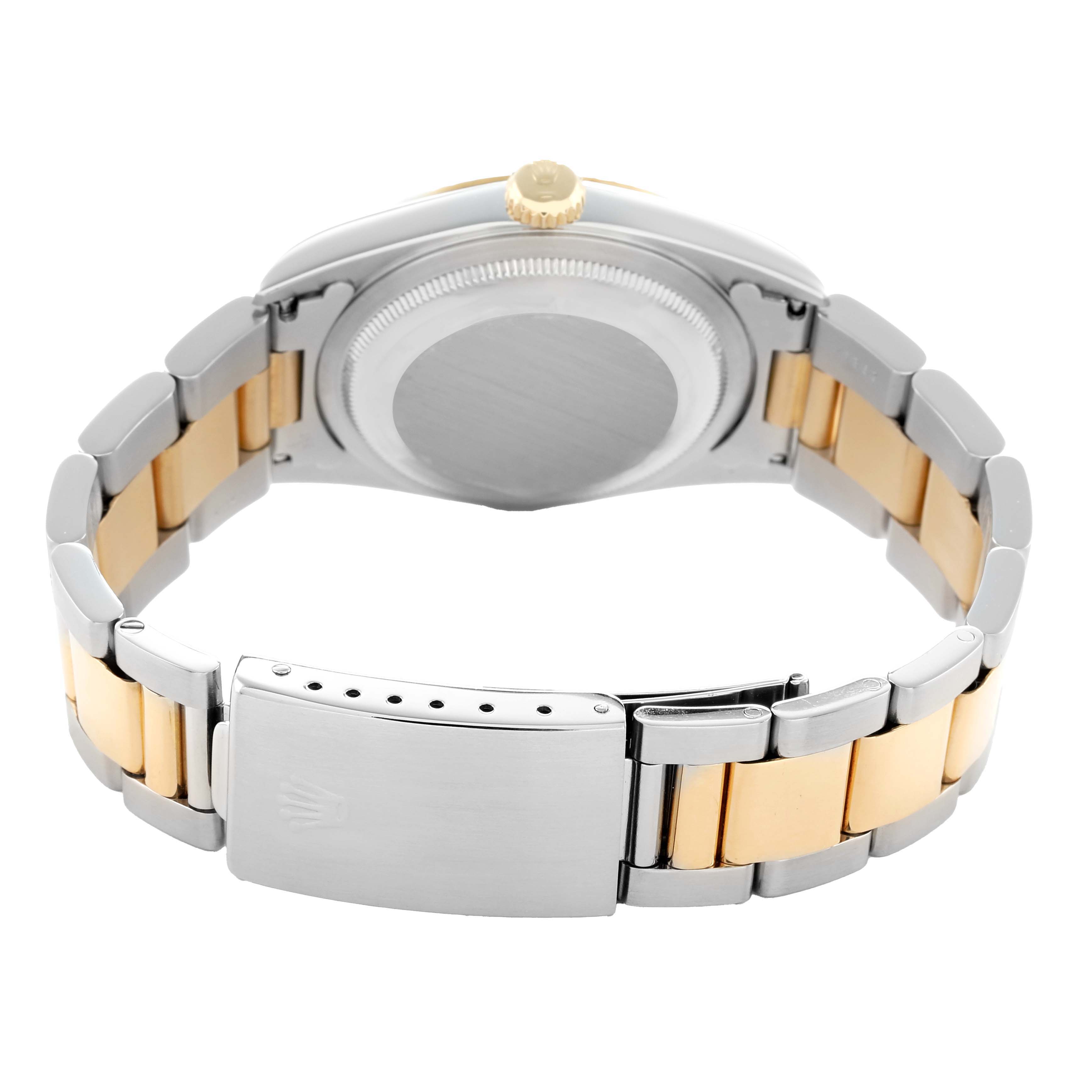 The image shows the backside of a Rolex Datejust 16233 Men's Steel and Gold (two tone) White Dial watch focusing on the clasp, bracelet, and case back.