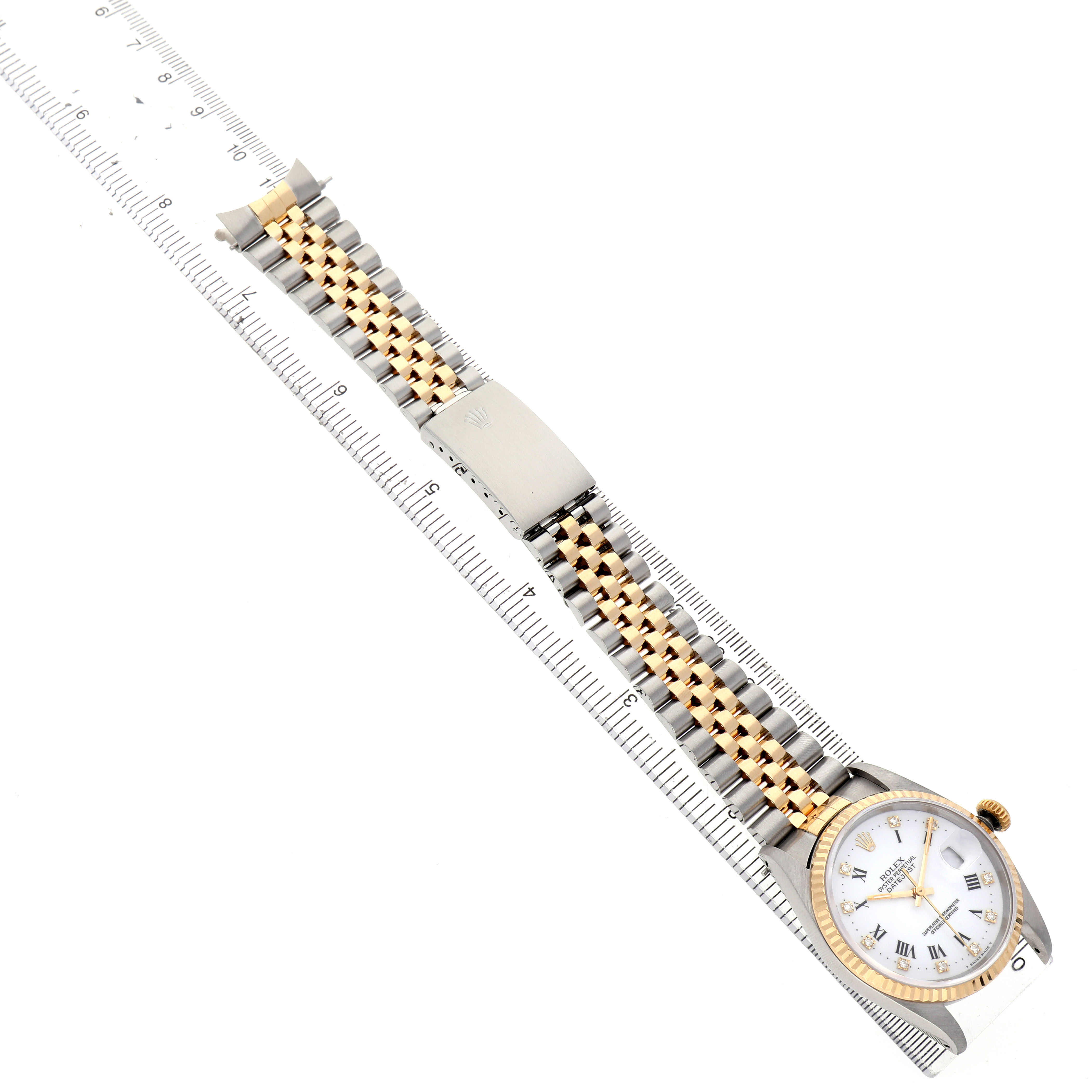 The image shows a Rolex Datejust 16233 Men's Stainless Steel White Dial watch from an angled top view, highlighting the dial, case, and Jubilee bracelet.