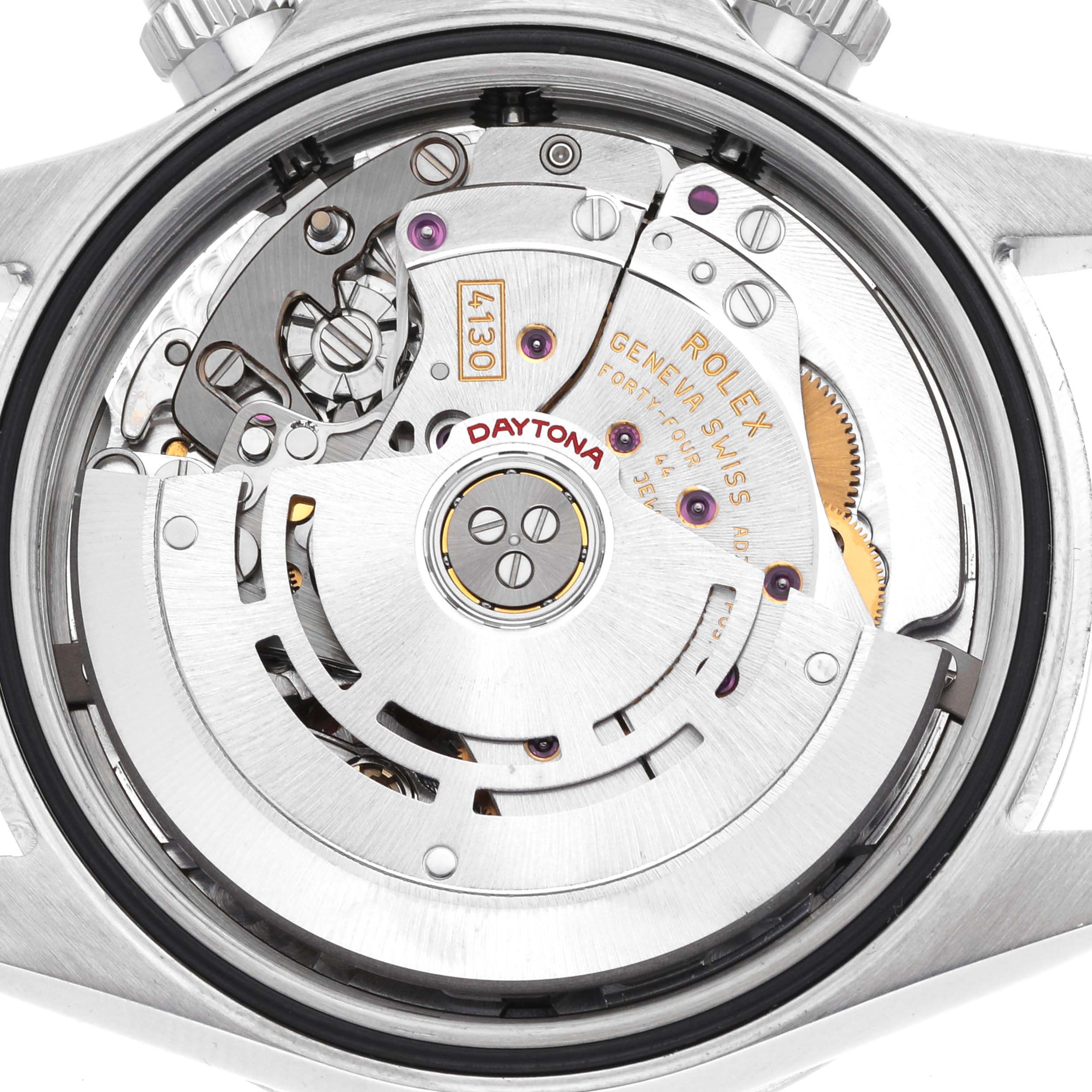 The image shows the Rolex Daytona 116520 Men's Stainless Steel Black Dial watch movement from the back, highlighting its intricate gears and components.