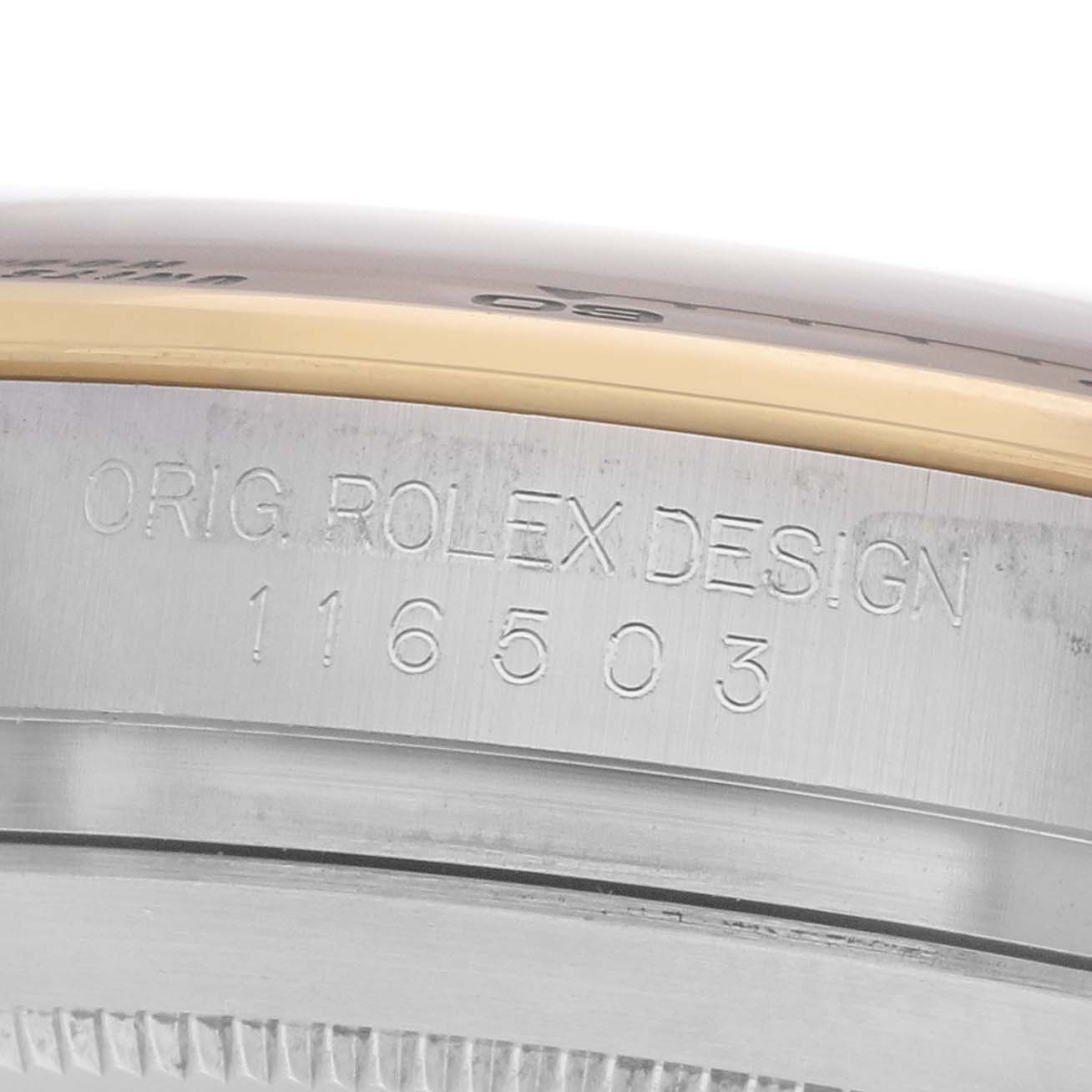 The image shows a close-up of the case side of a Rolex Daytona 116503 Men's Steel and Gold (two tone) Blue Dial, highlighting the engraved model number.